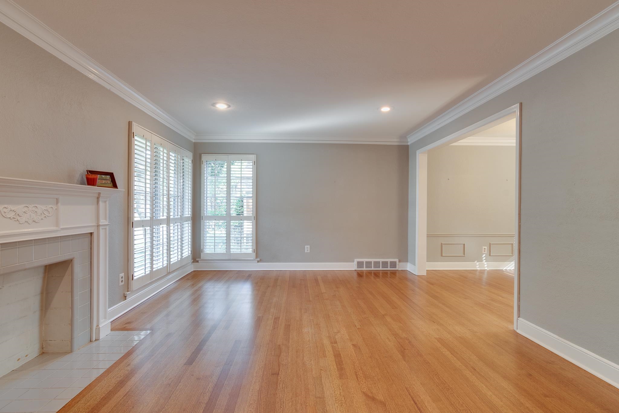 4165 Minden Road Memphis, TN 38117 - Photo 5 of 25 a view of an empty room with wooden floor and a window