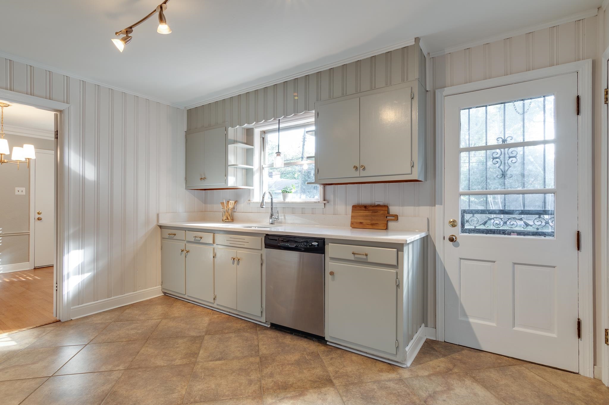 4165 Minden Road Memphis, TN 38117 - Photo 8 of 25 a kitchen with granite countertop white cabinets and white appliances
