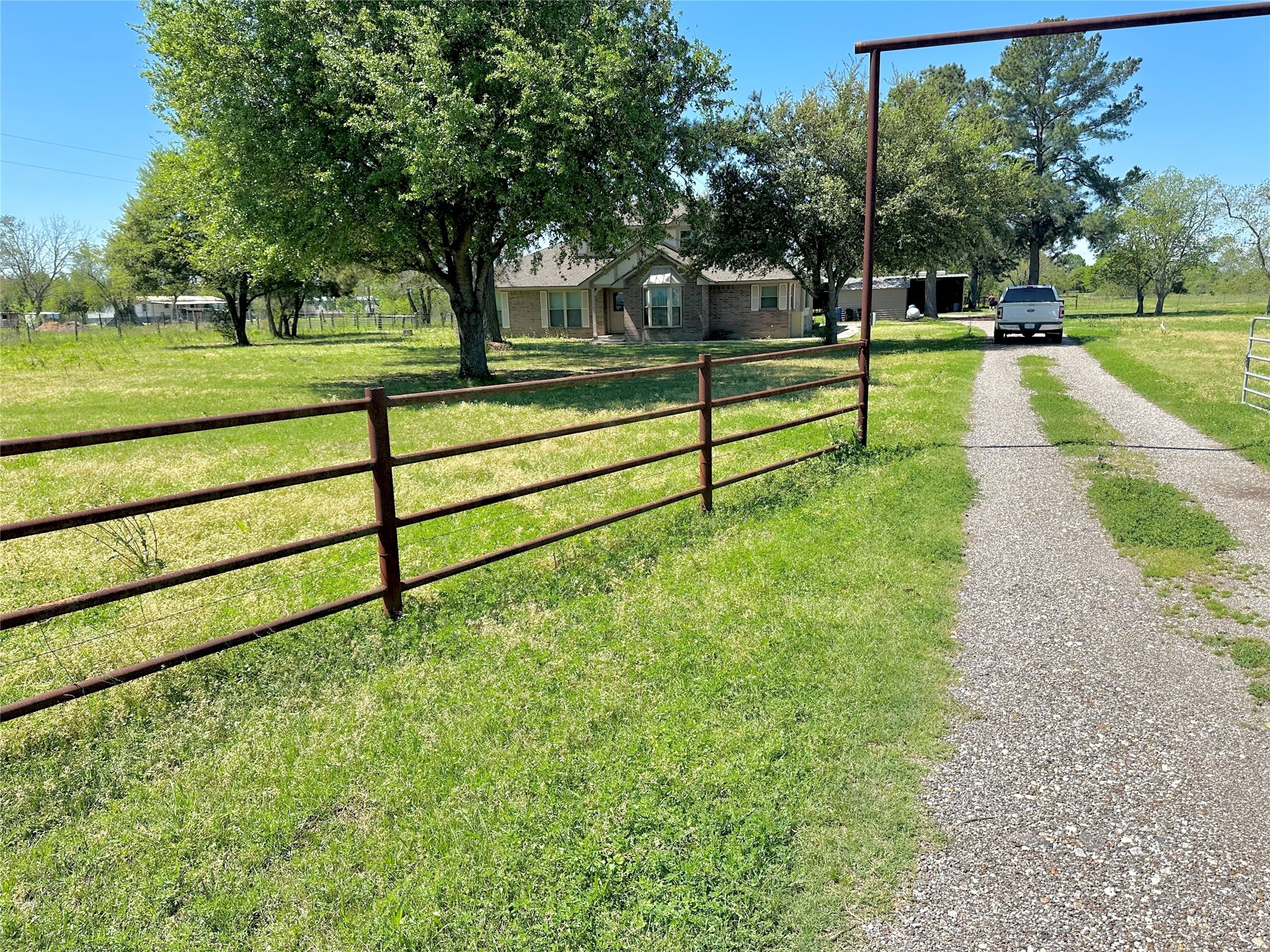 a view of a park with large trees