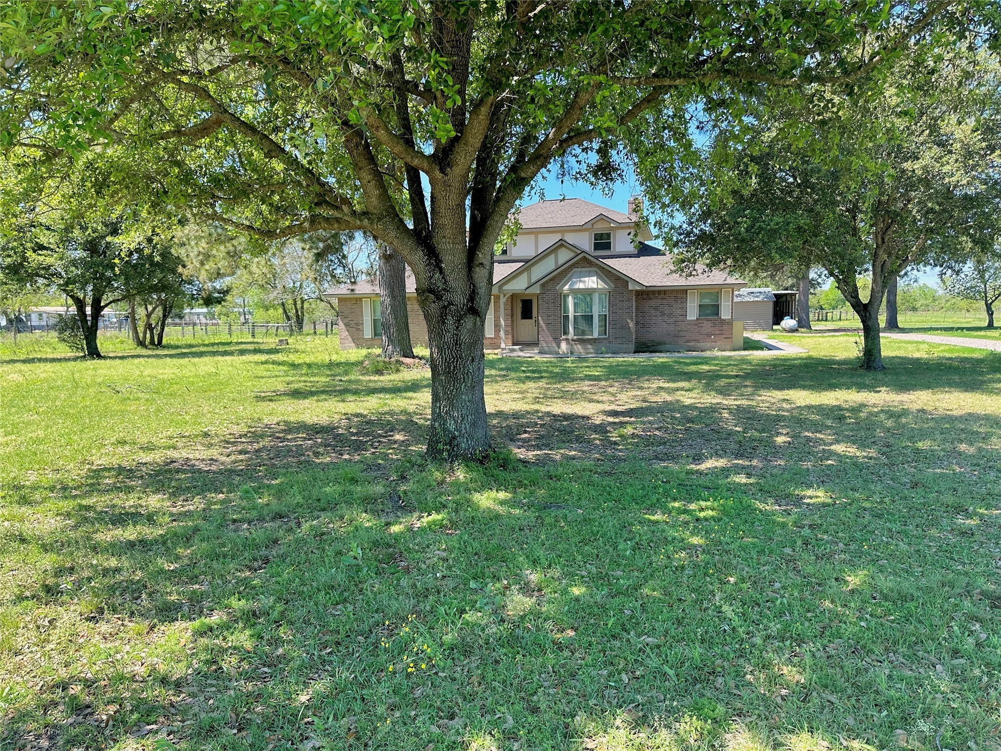 19303 Becker Road Hockley, TX 77447 - Photo 2 of 17 a front view of a house with a garden