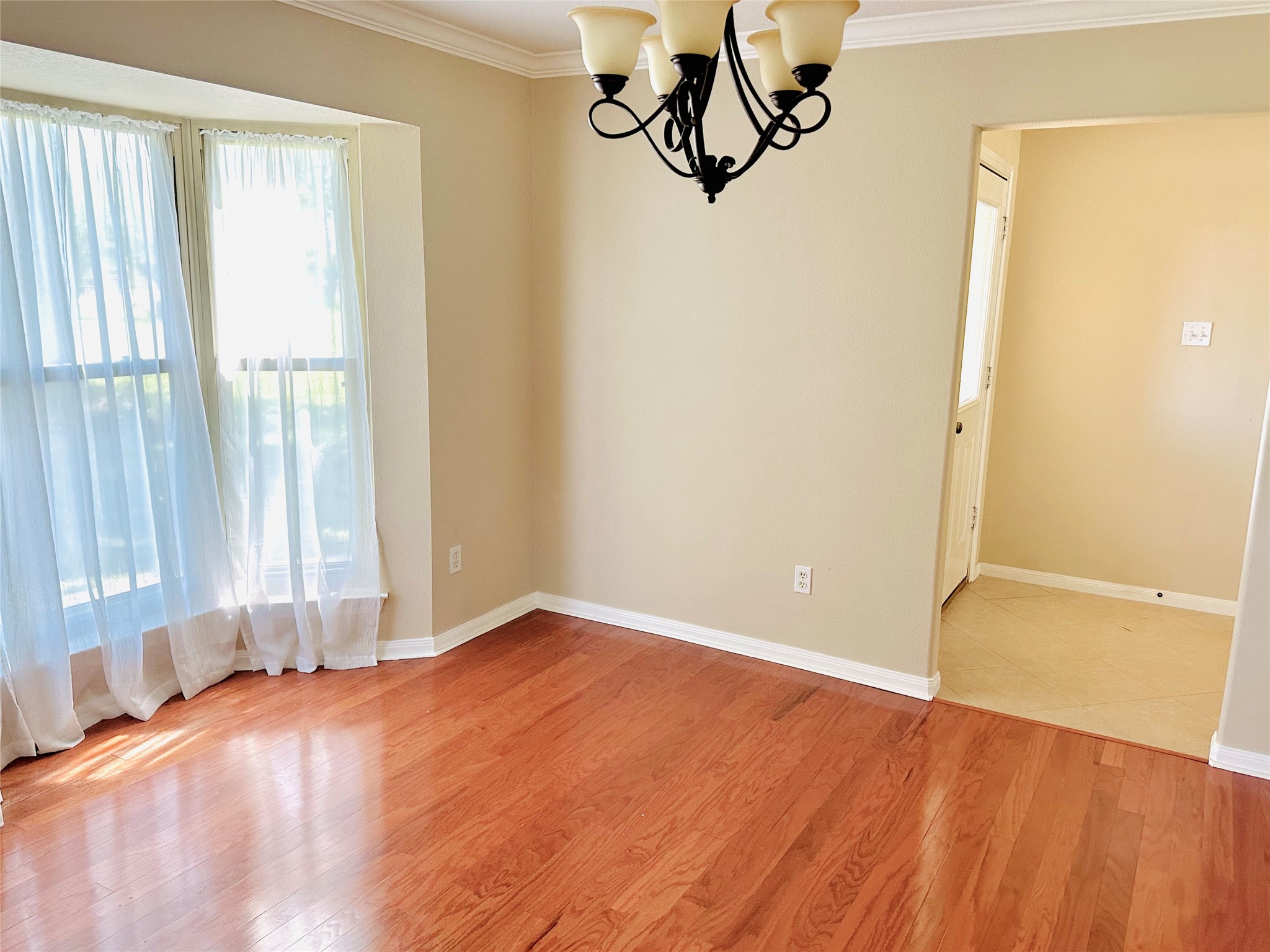 19303 Becker Road Hockley, TX 77447 - Photo 4 of 17 an empty room with wooden floor and windows
