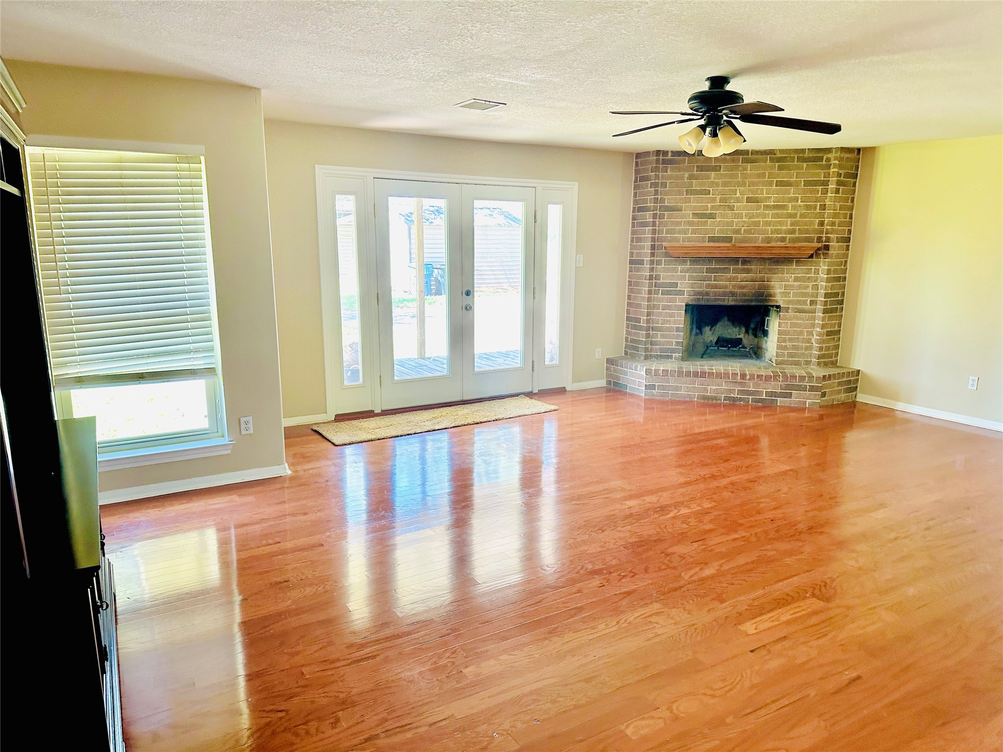 19303 Becker Road Hockley, TX 77447 - Photo 5 of 17 a view of an empty room with glass door and wooden floor