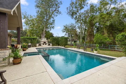 a view of swimming pool with chairs