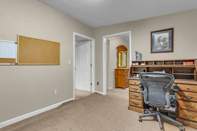 a view of a workspace with furniture