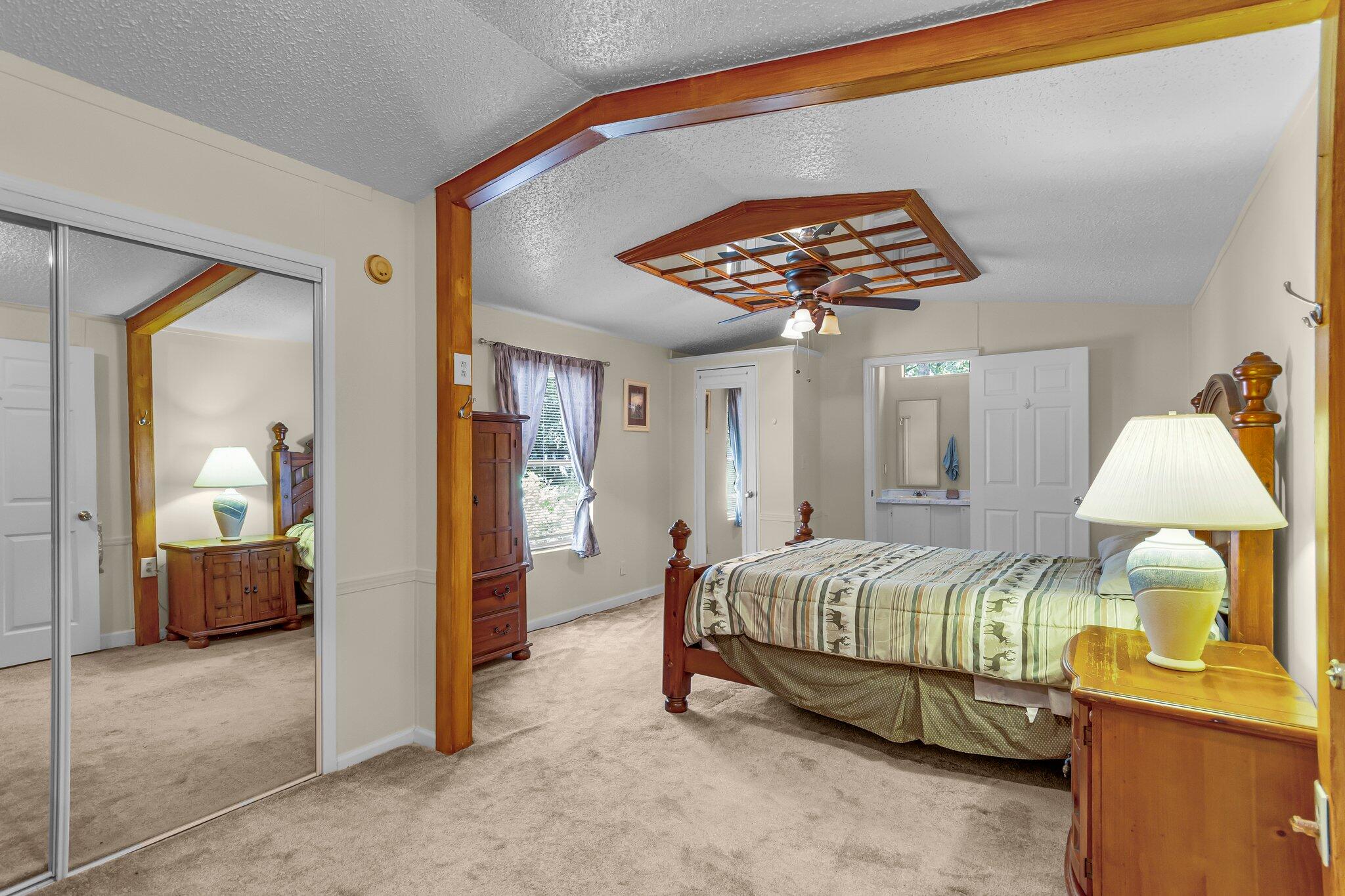 2 Sarah Lane Fort Walton Beach, FL 32547 - Photo 20 of 41 a bedroom with a bed and a chandelier