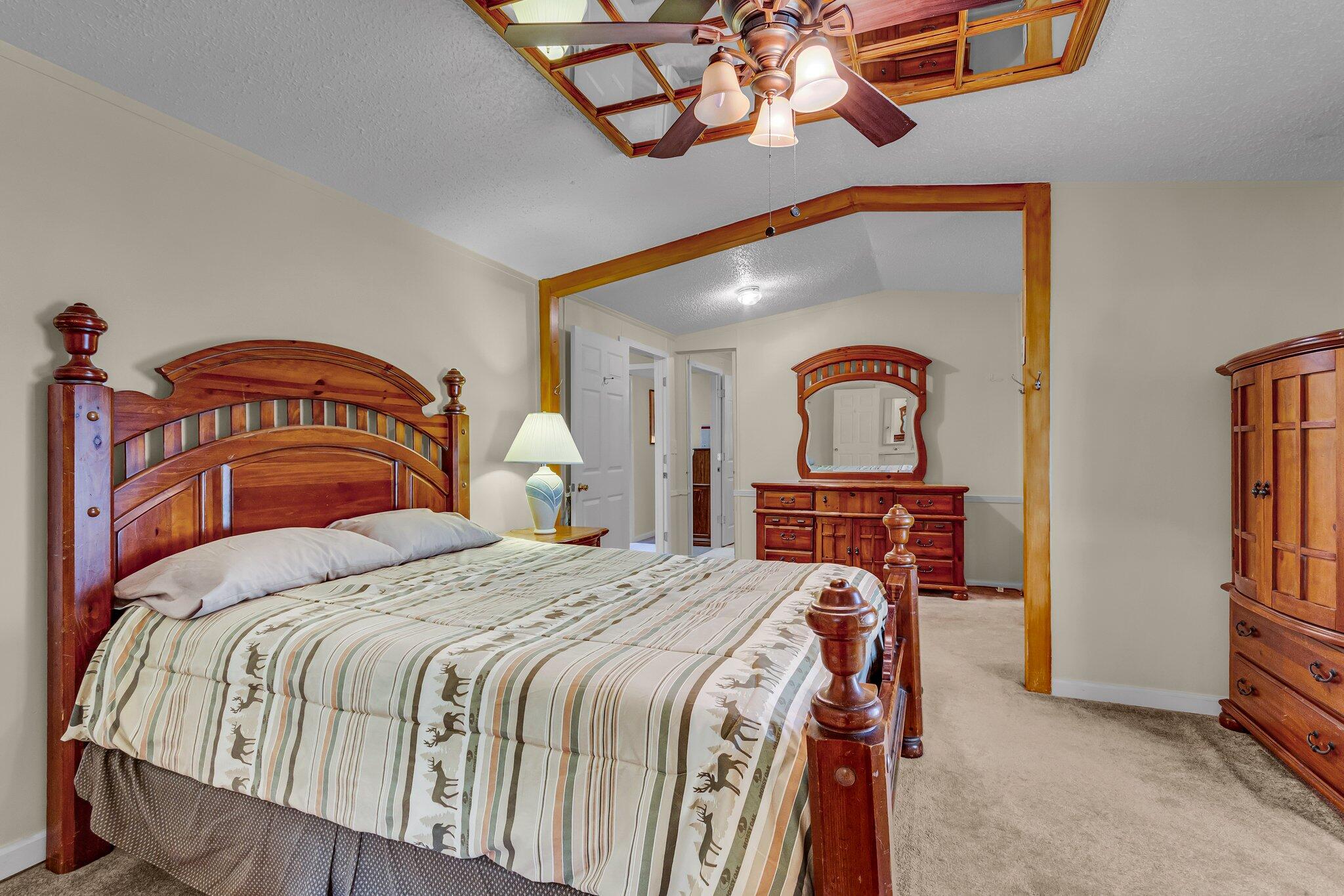 2 Sarah Lane Fort Walton Beach, FL 32547 - Photo 22 of 41 a bedroom with a bed and a chandelier