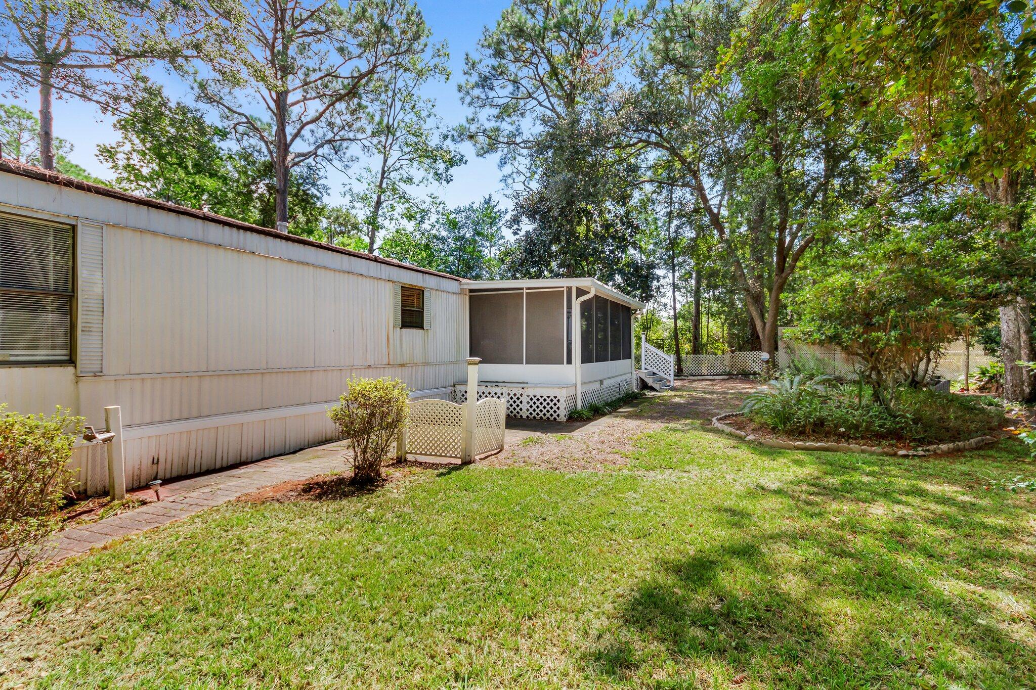 2 Sarah Lane Fort Walton Beach, FL 32547 - Photo 34 of 41 a view of backyard with seating and green space