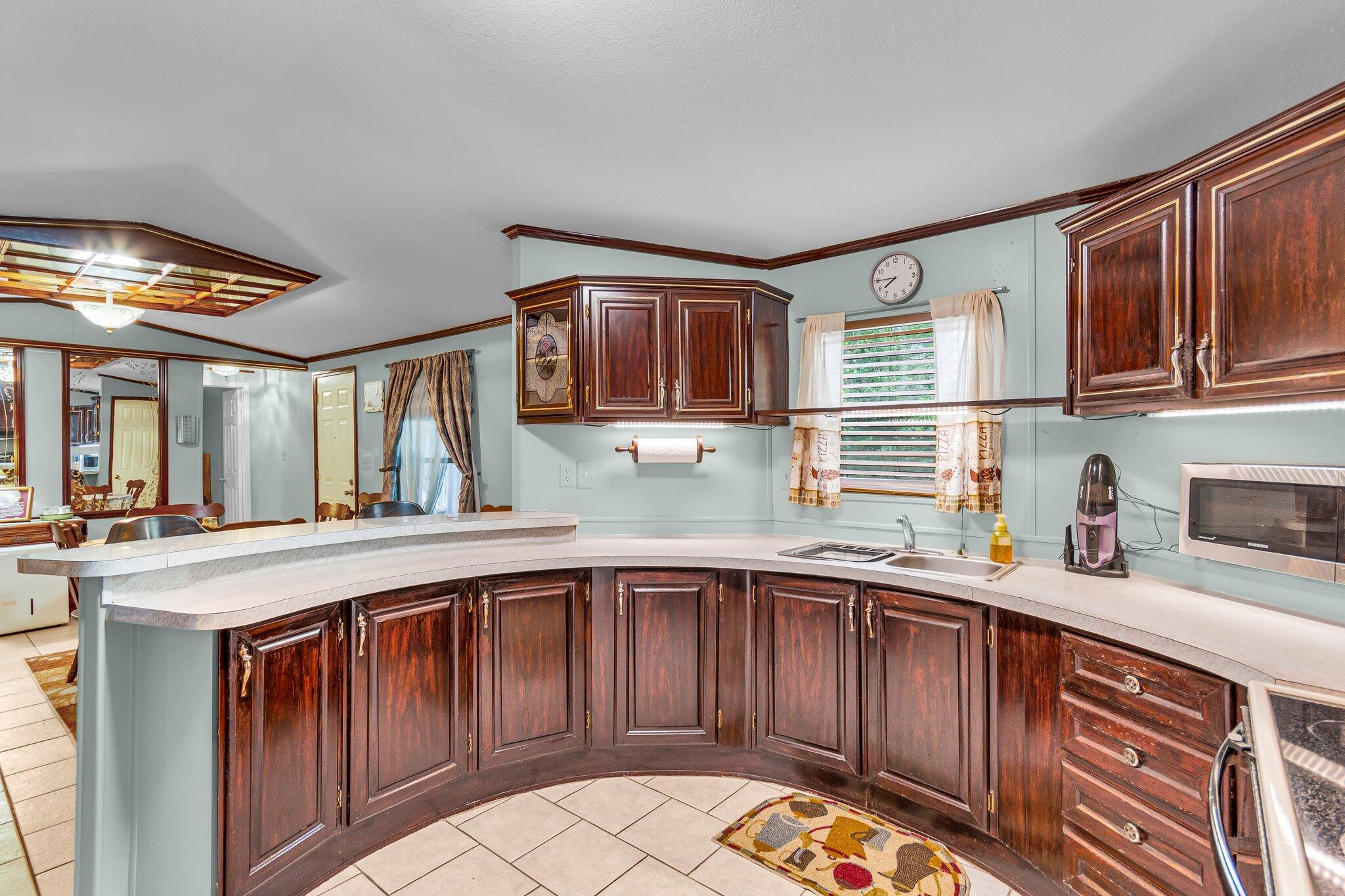 2 Sarah Lane Fort Walton Beach, FL 32547 - Photo 37 of 41 a kitchen with a sink window and cabinets