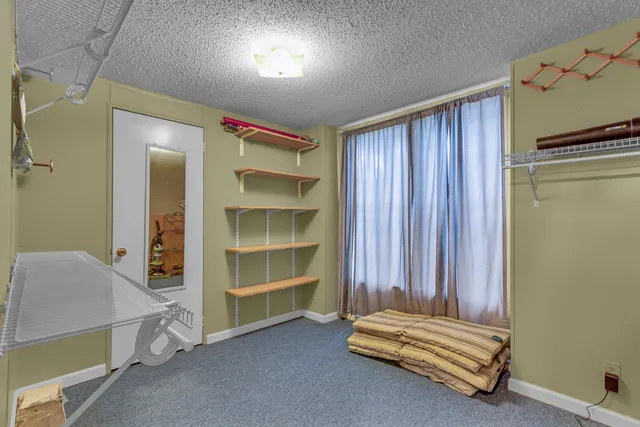 a view of room with air conditioner and window