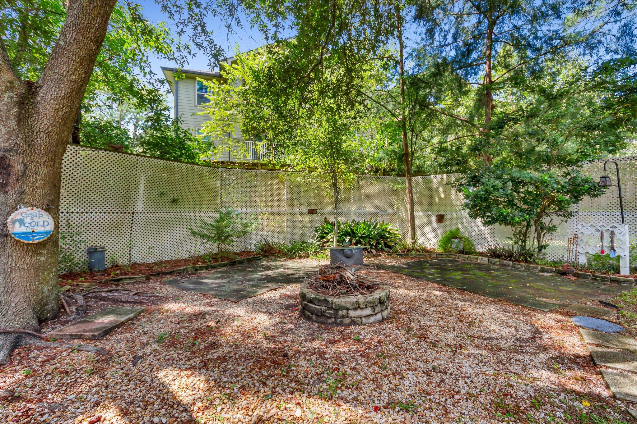 2 Sarah Lane Fort Walton Beach, FL 32547 - Photo 40 of 41 a backyard of a house with plants and tree