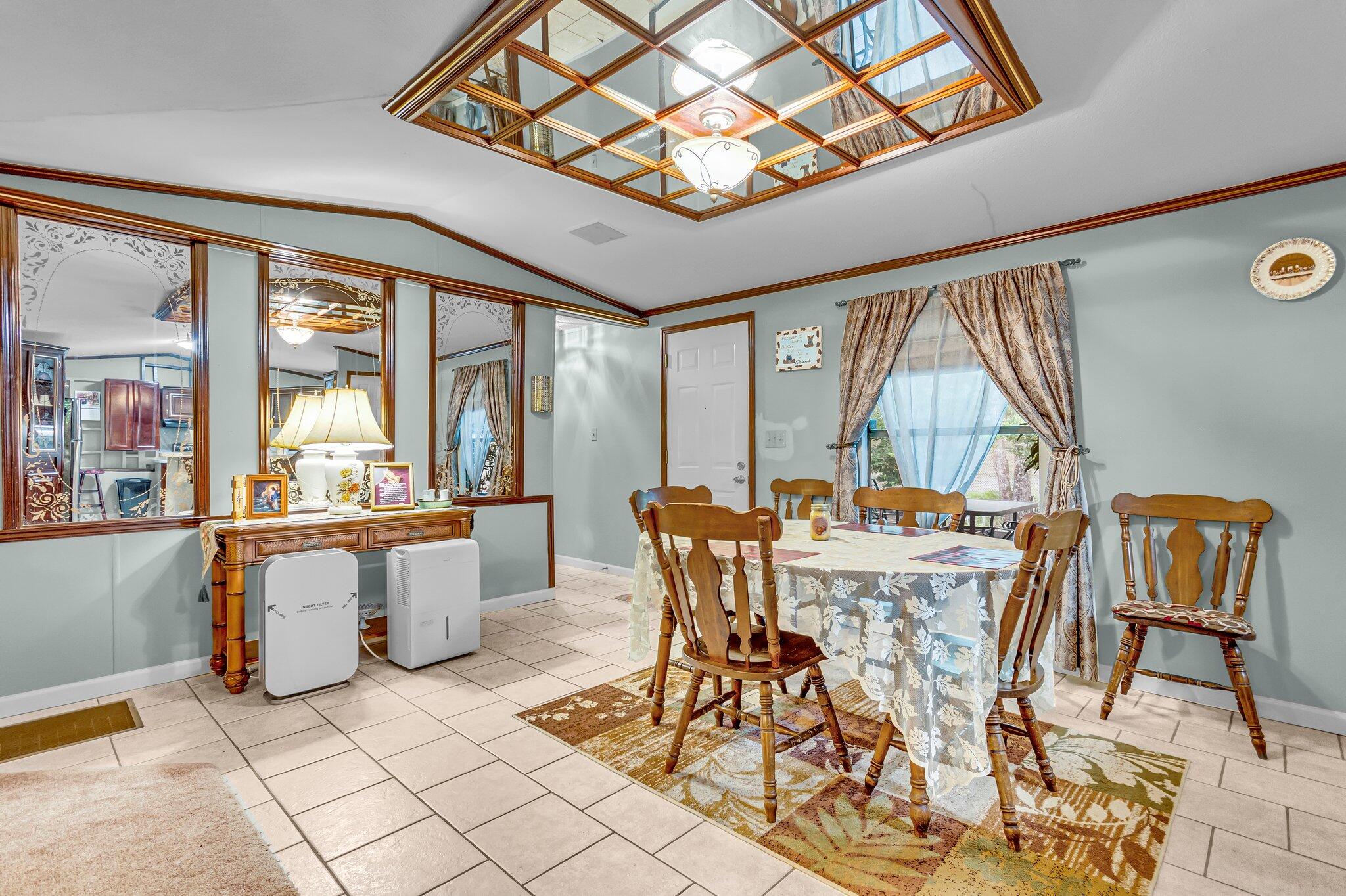 2 Sarah Lane Fort Walton Beach, FL 32547 - Photo 4 of 41 a view of a dining room with furniture wooden floor and a chandelier