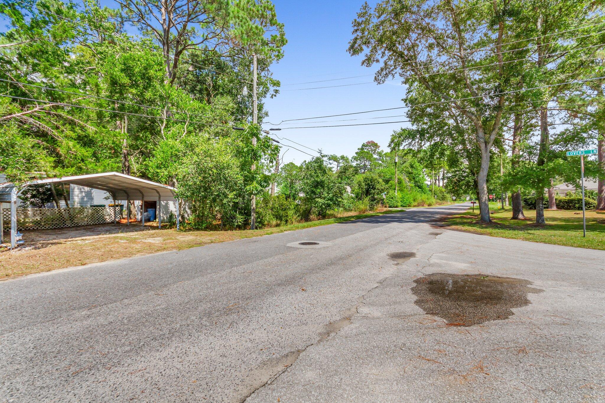 2 Sarah Lane Fort Walton Beach, FL 32547 - Photo 6 of 41 a front view of a house with a yard and trees