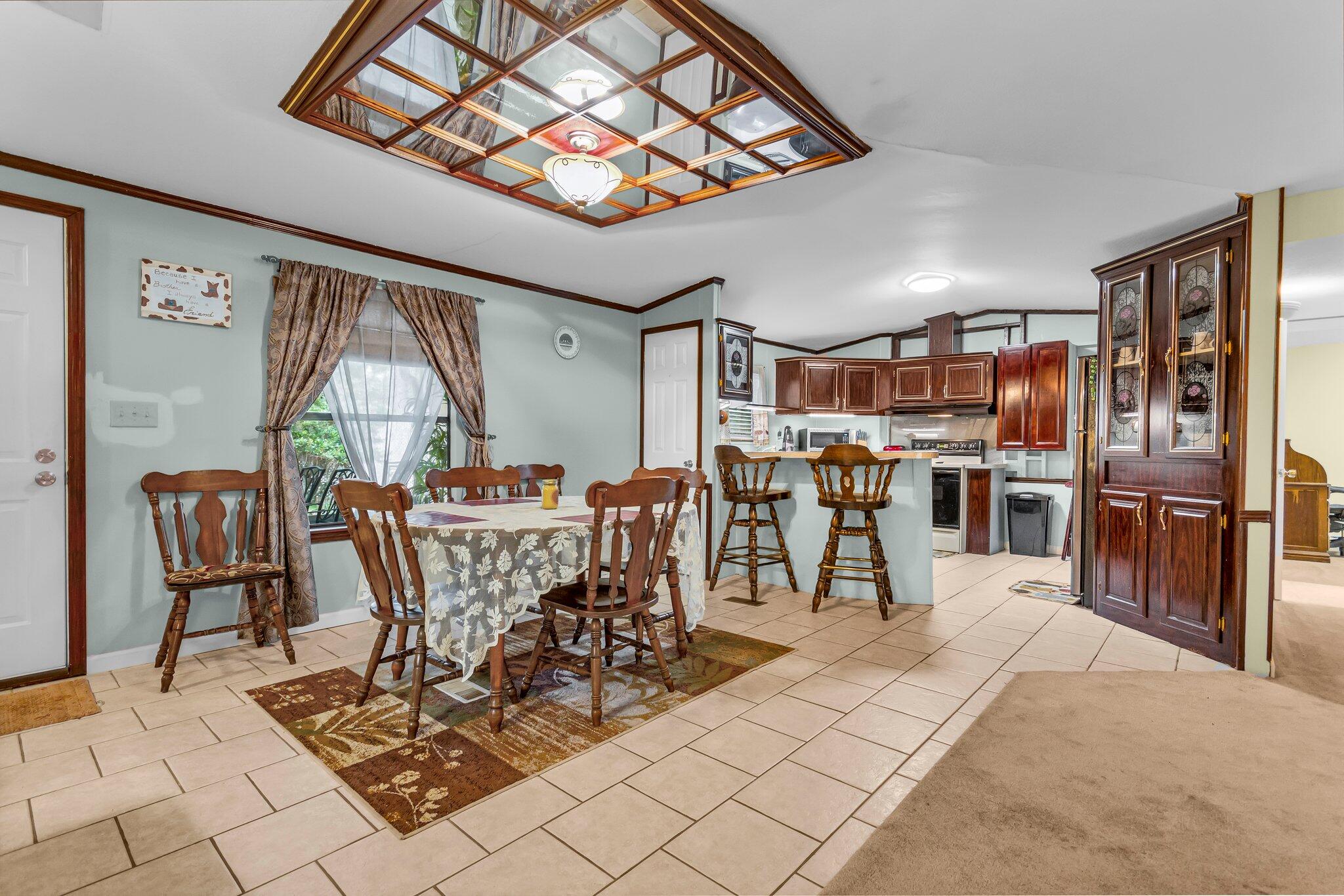 2 Sarah Lane Fort Walton Beach, FL 32547 - Photo 10 of 41 a view of a dining room with furniture window and outside view