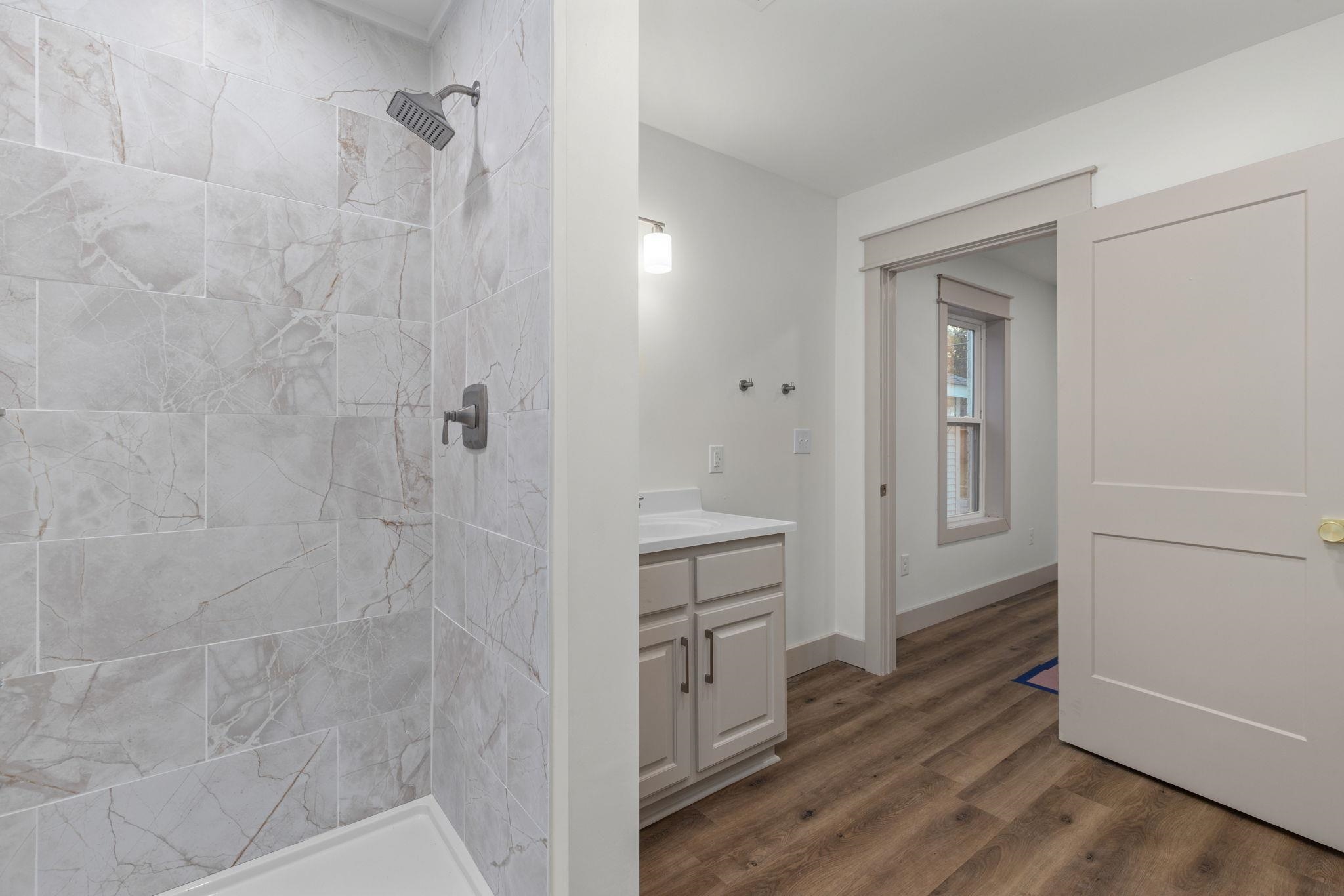 1008 North Madison Street Corinth, MS 38834 - Photo 11 of 33 a bathroom with a shower