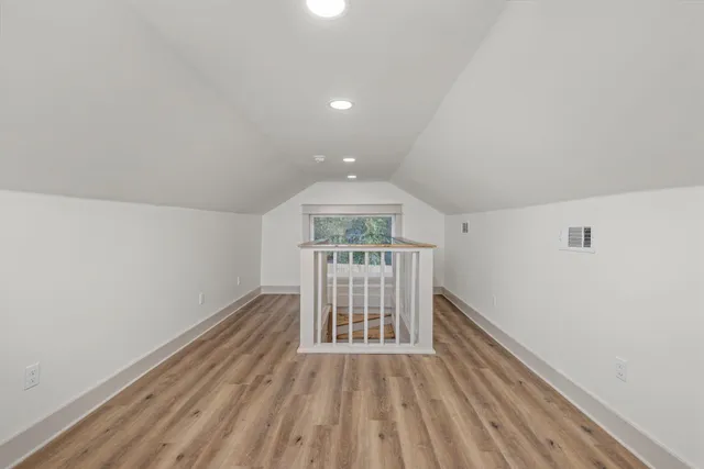 a view of entryway with wooden floor