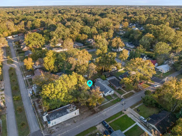 an aerial view of residential houses with outdoor space