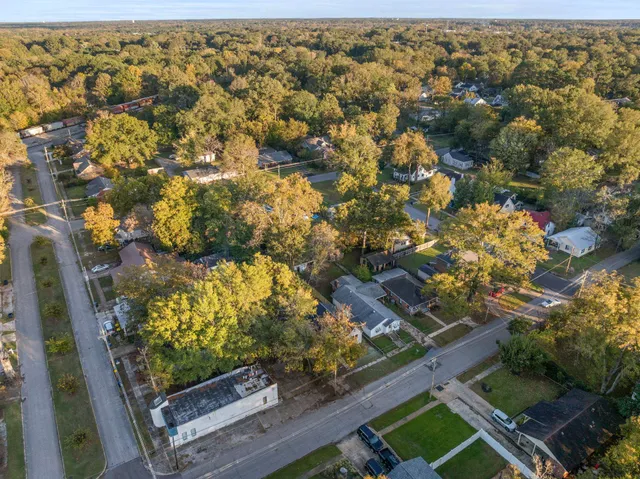an aerial view of residential houses with outdoor space