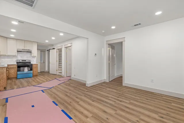 a view of kitchen and wooden floor