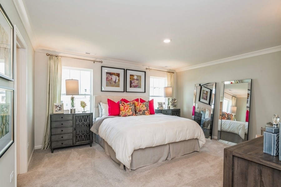 1323 Draper Road McHenry, IL 60050 - Photo 8 of 17 a bedroom with a large bed and a dresser