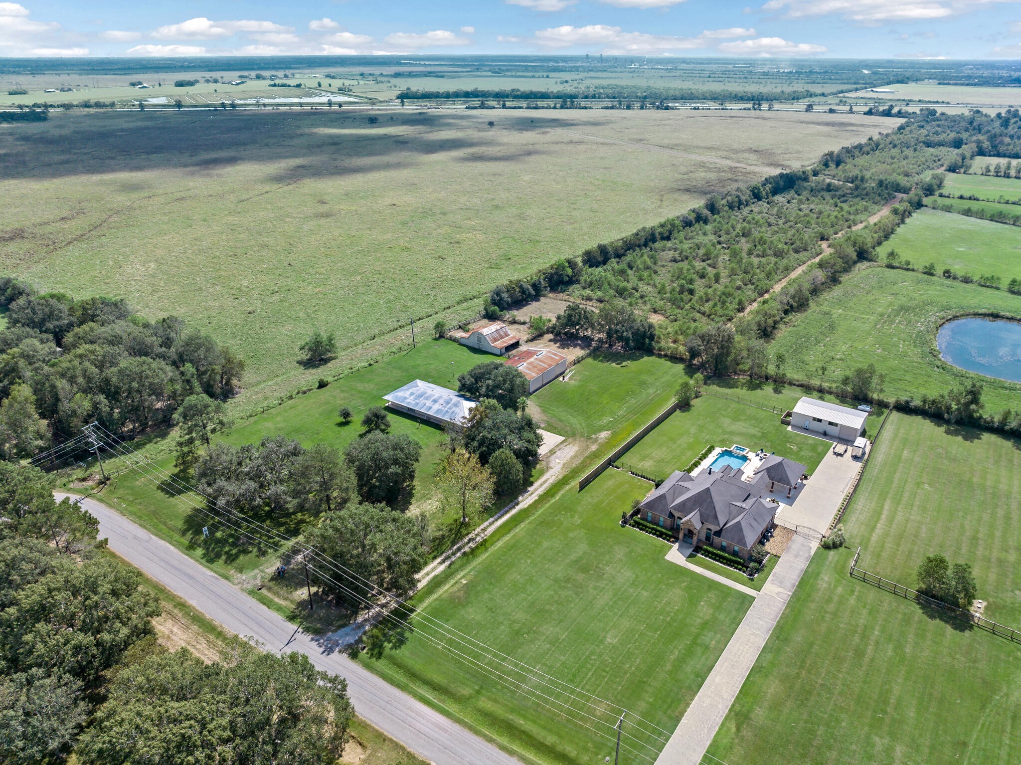 3030 Moore Road Beaumont, TX 77713 - Photo 27 of 38 an aerial view of a house with a lake view