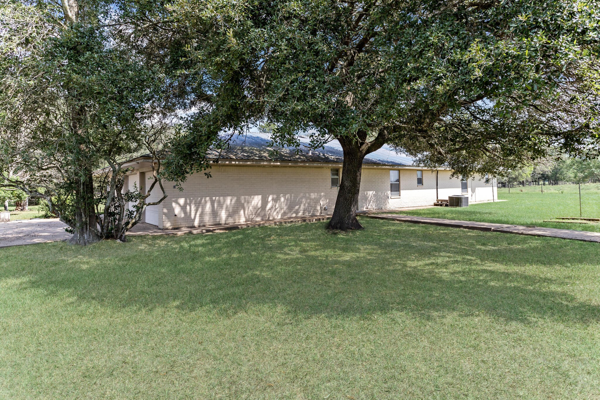 3030 Moore Road Beaumont, TX 77713 - Photo 36 of 38 a swimming pool with outdoor seating and garden