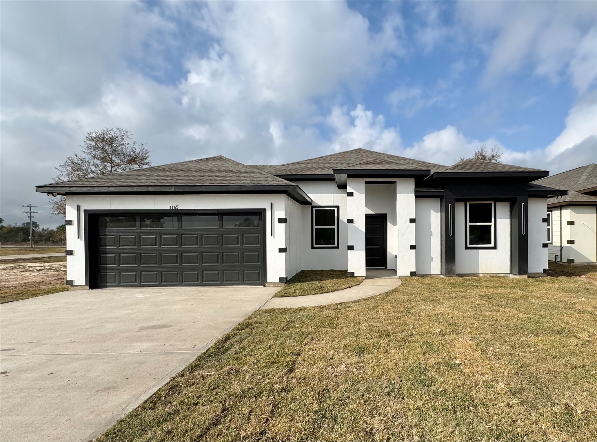 front view of a house with a large window