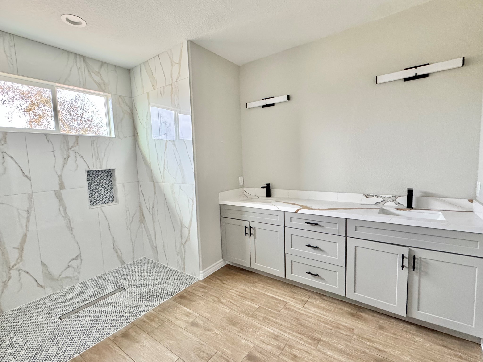 1165 Road 5203 Cleveland, TX 77327 - Photo 13 of 20 a spacious bathroom with a double vanity sink and a mirror