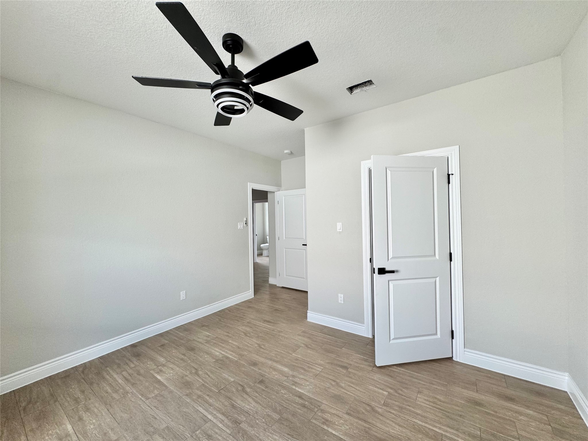 1165 Road 5203 Cleveland, TX 77327 - Photo 16 of 20 wooden floor in an empty room