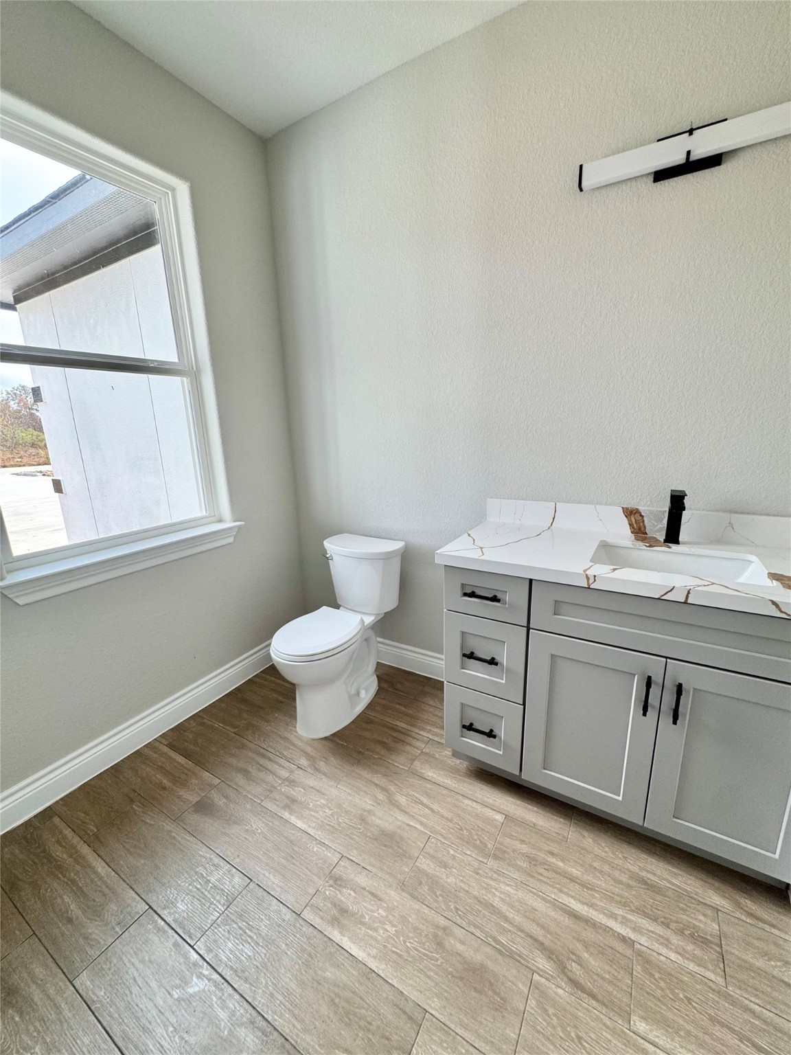 1165 Road 5203 Cleveland, TX 77327 - Photo 18 of 20 a spacious bathroom with a toilet sink and a window