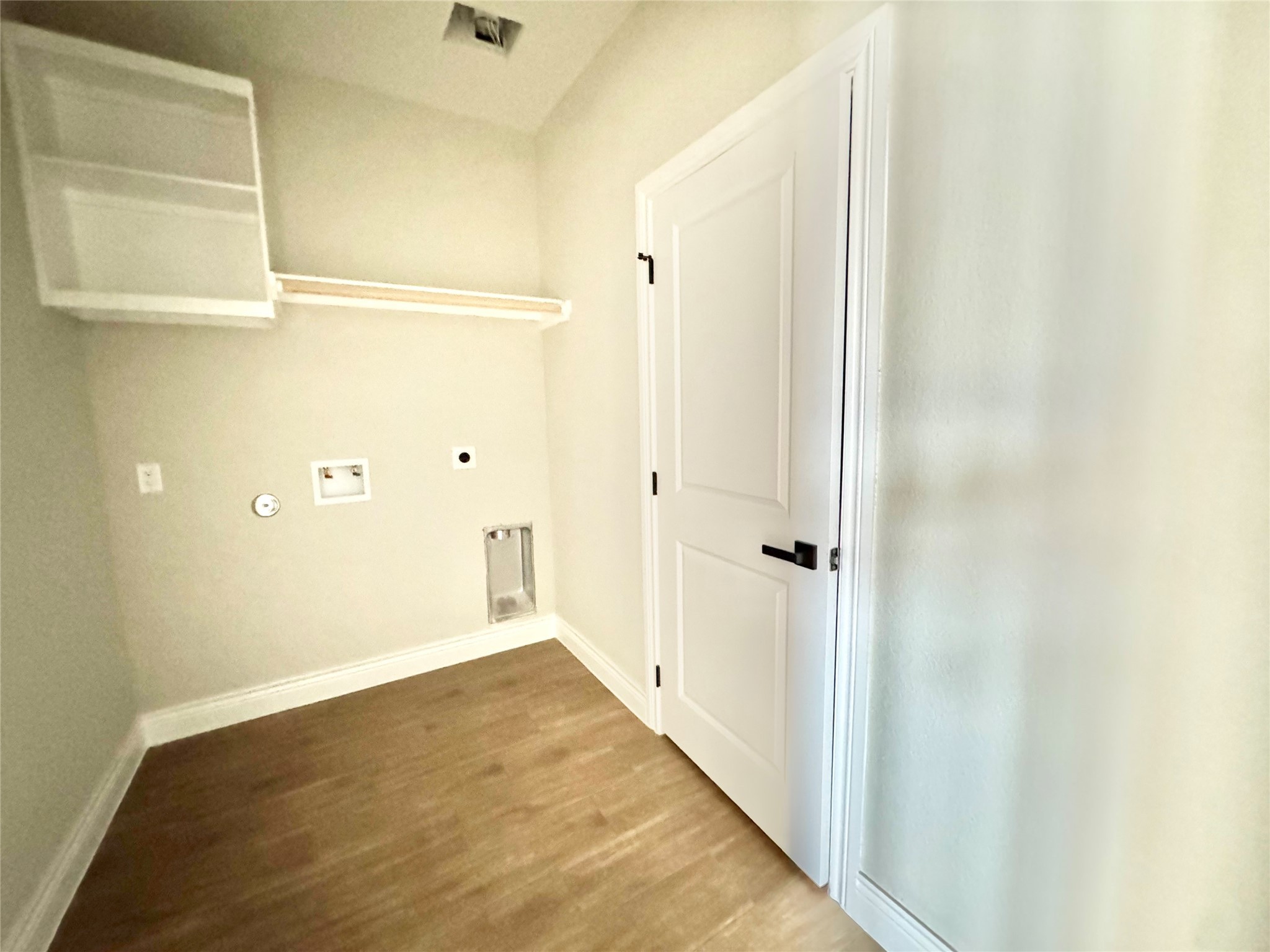 1165 Road 5203 Cleveland, TX 77327 - Photo 19 of 20 a view of a hallway with wooden floor