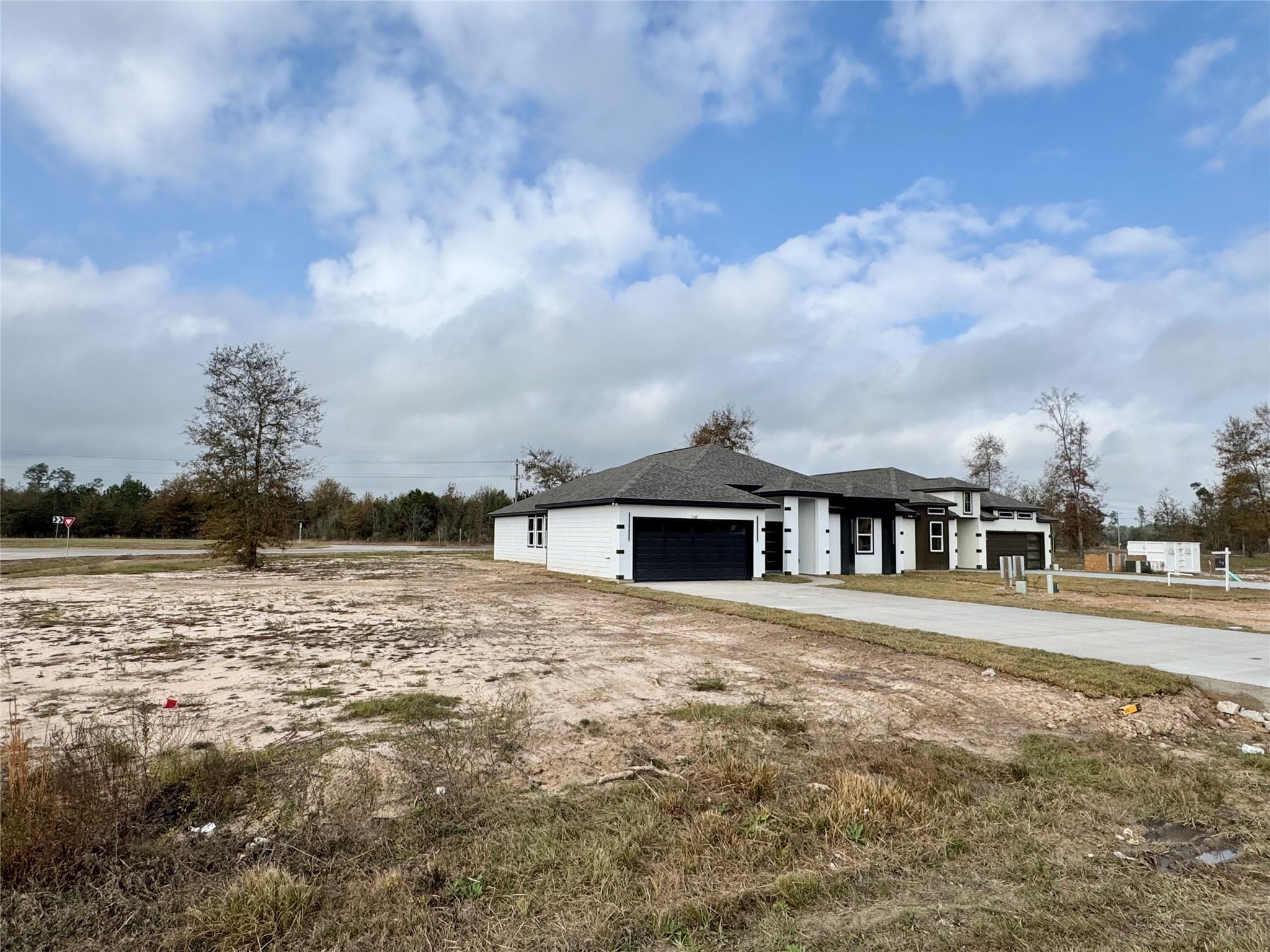 1165 Road 5203 Cleveland, TX 77327 - Photo 2 of 20 a view of a lake with a big yard