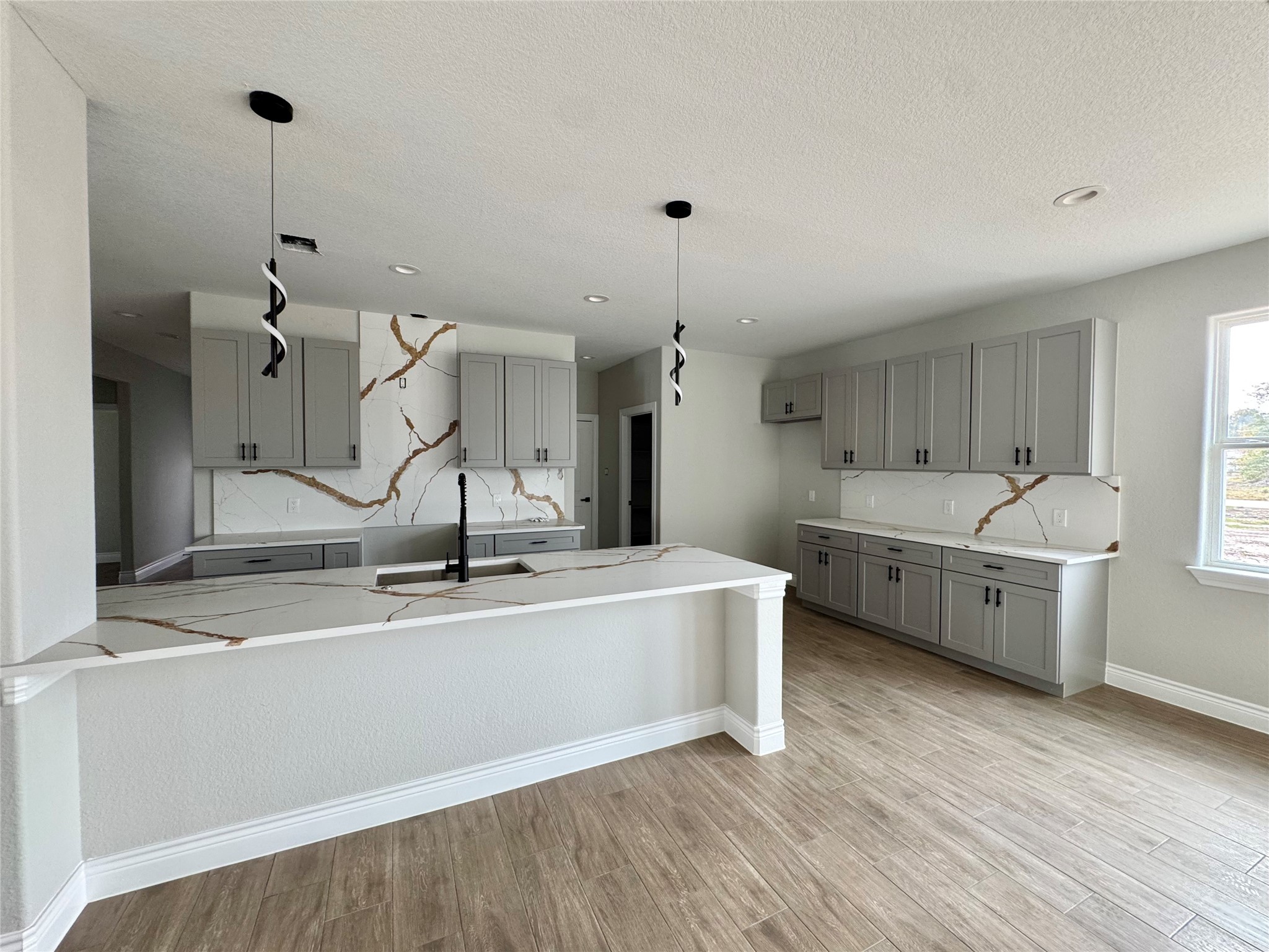 1165 Road 5203 Cleveland, TX 77327 - Photo 6 of 20 a large kitchen with a sink a counter top space stainless steel appliances and a window