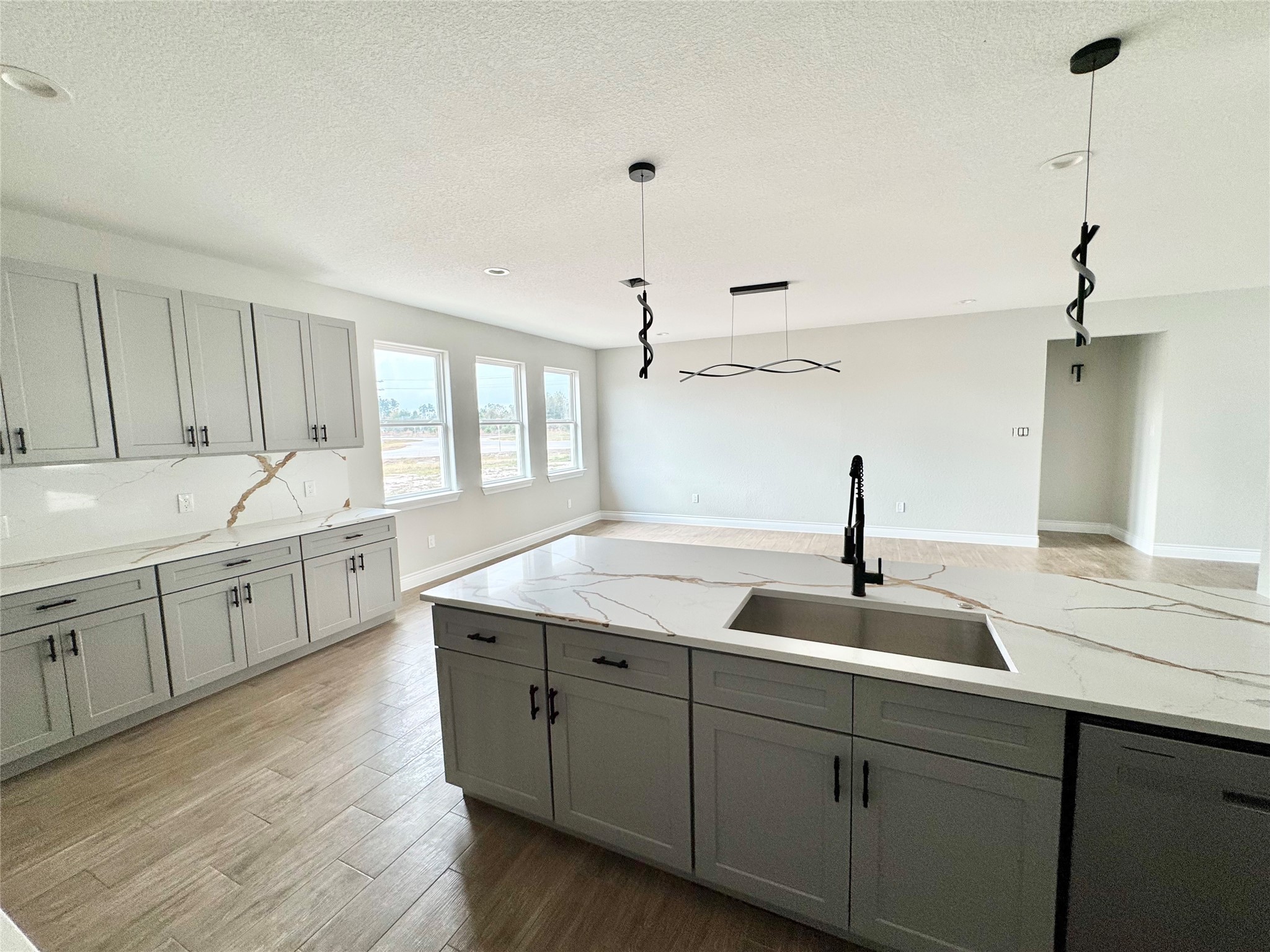 1165 Road 5203 Cleveland, TX 77327 - Photo 7 of 20 a kitchen with sink cabinets and wooden floor