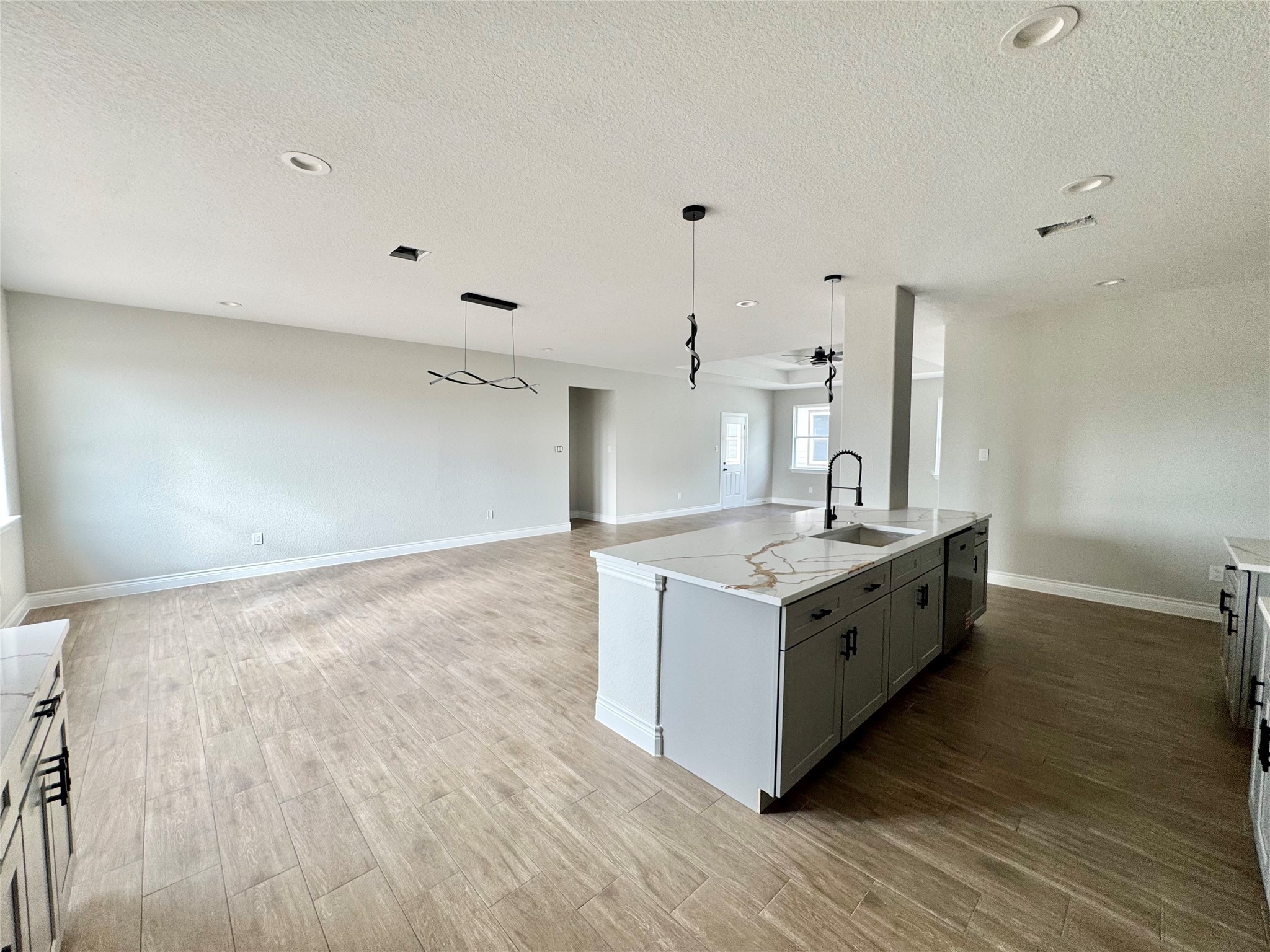 1165 Road 5203 Cleveland, TX 77327 - Photo 8 of 20 a kitchen with granite countertop a stove and a sink