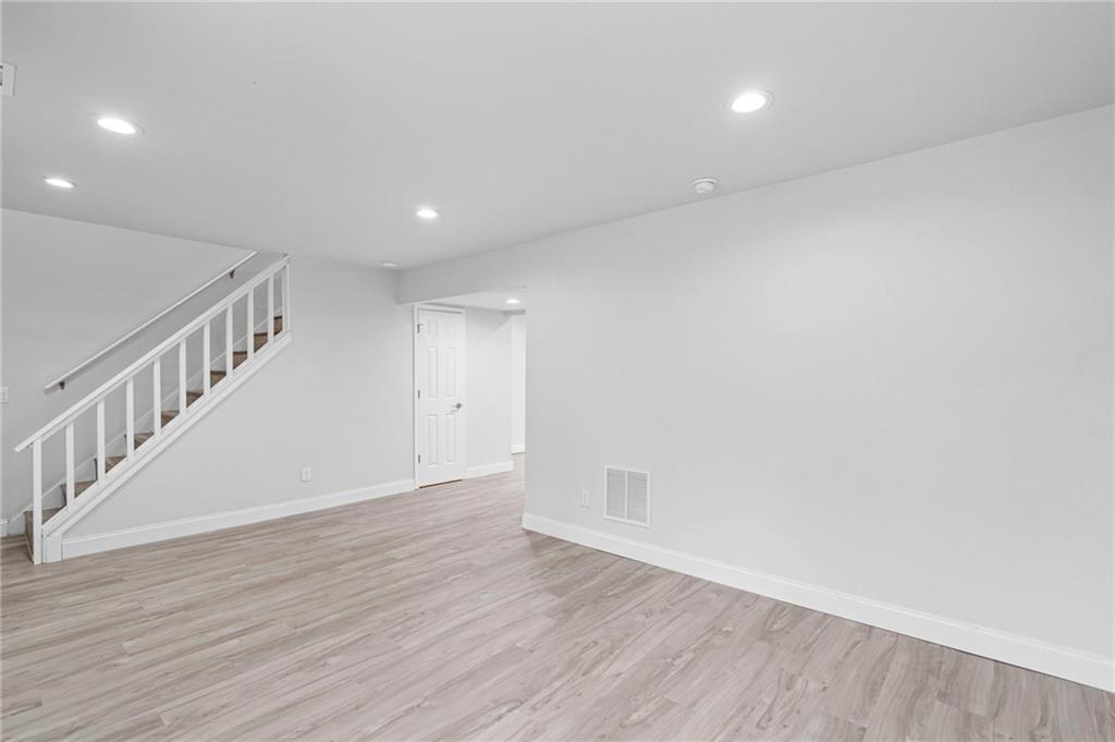 1342 North Hampton Road Alpharetta, GA 30009 - Photo 12 of 29 a view of an empty room with wooden floor