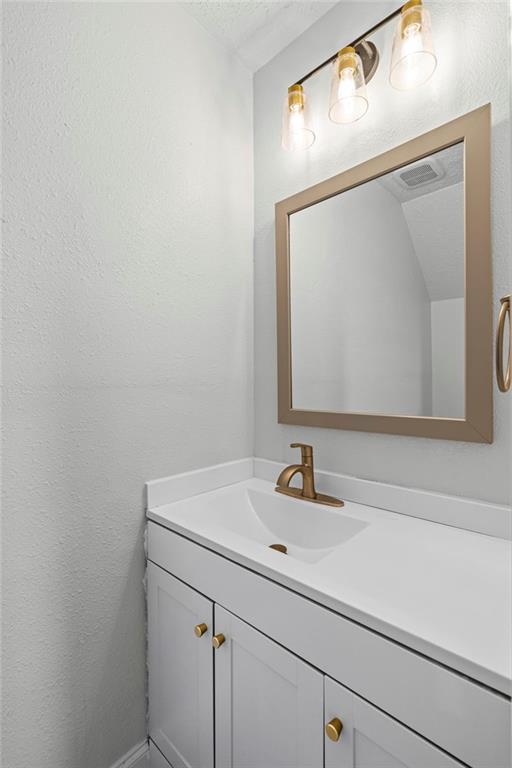 1342 North Hampton Road Alpharetta, GA 30009 - Photo 19 of 29 a bathroom with a sink and a mirror