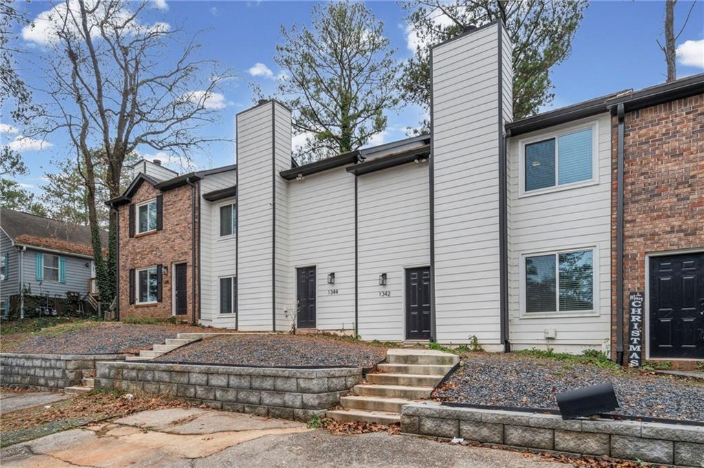 1342 North Hampton Road Alpharetta, GA 30009 - Photo 4 of 29 a front view of a house with a yard