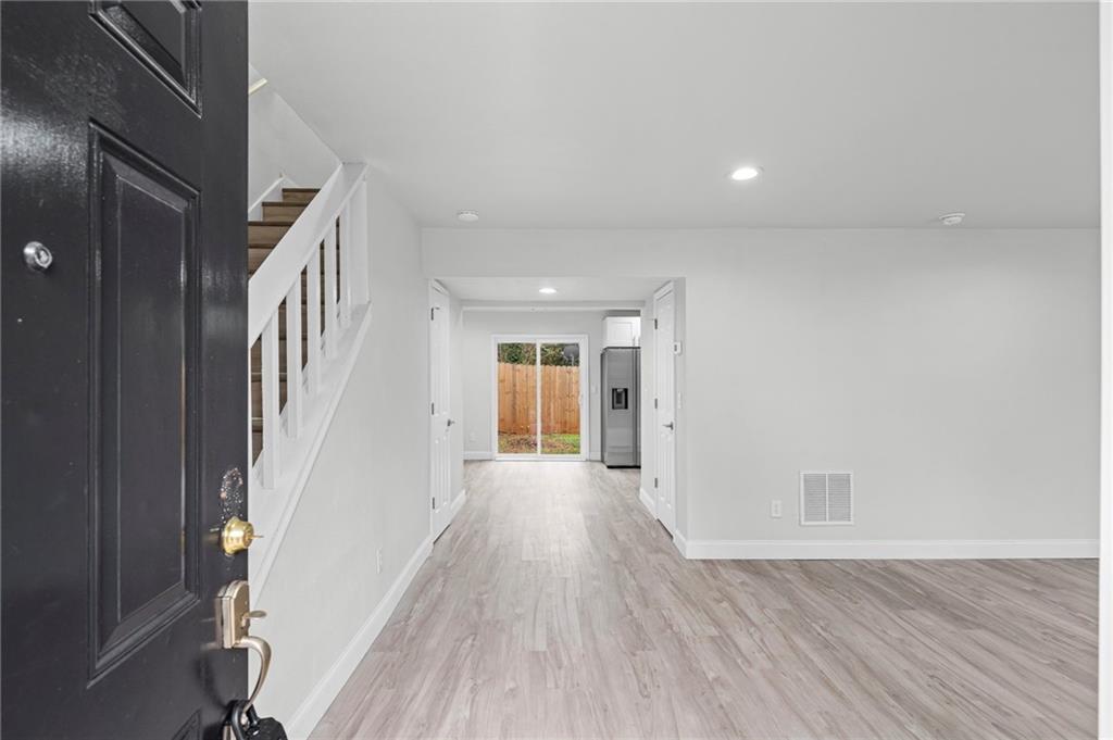 1342 North Hampton Road Alpharetta, GA 30009 - Photo 8 of 29 wooden floor in an empty room with a window