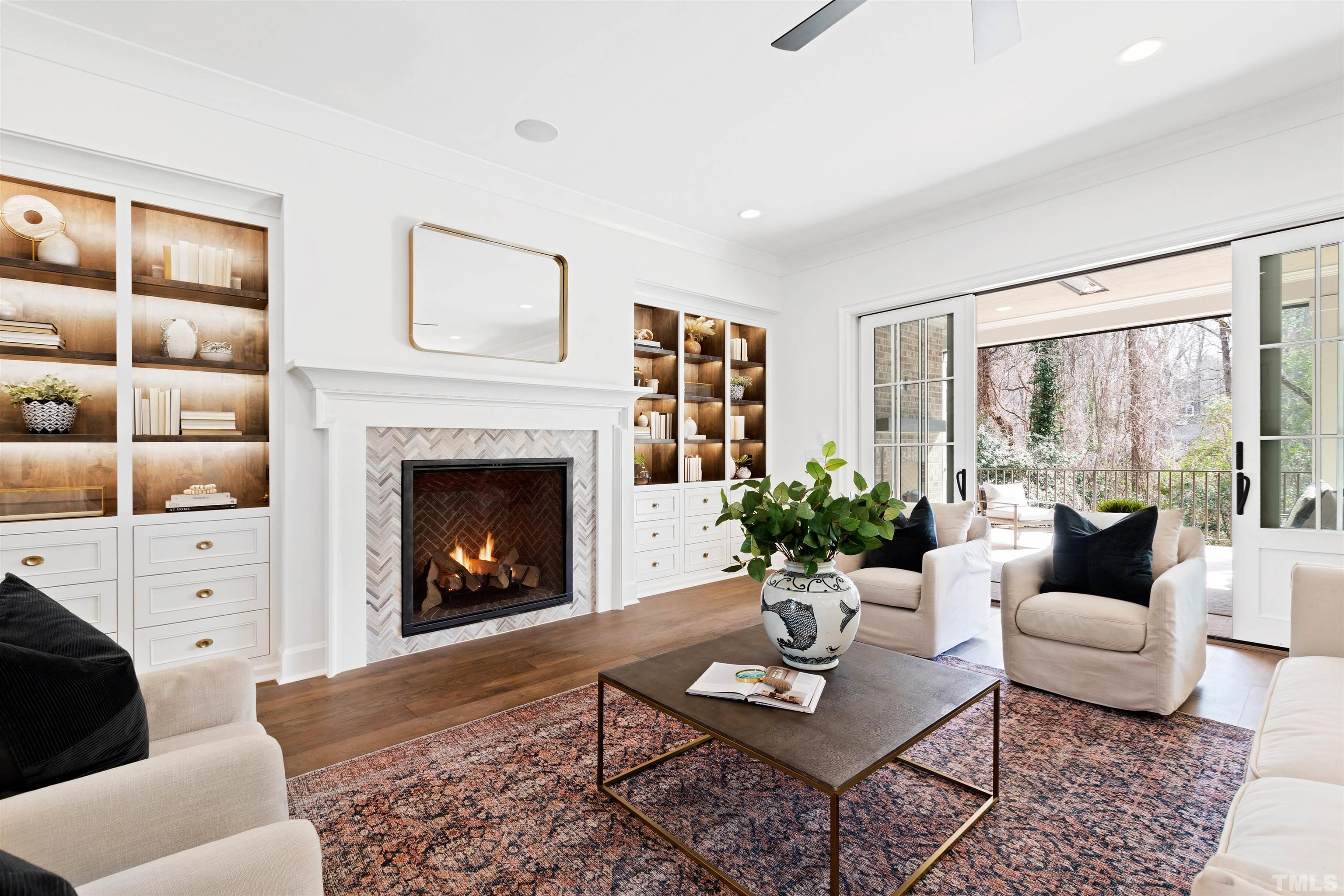 1716 Nottingham Road Raleigh, NC 27607 - Photo 12 of 78 a living room with furniture a fireplace and a large window