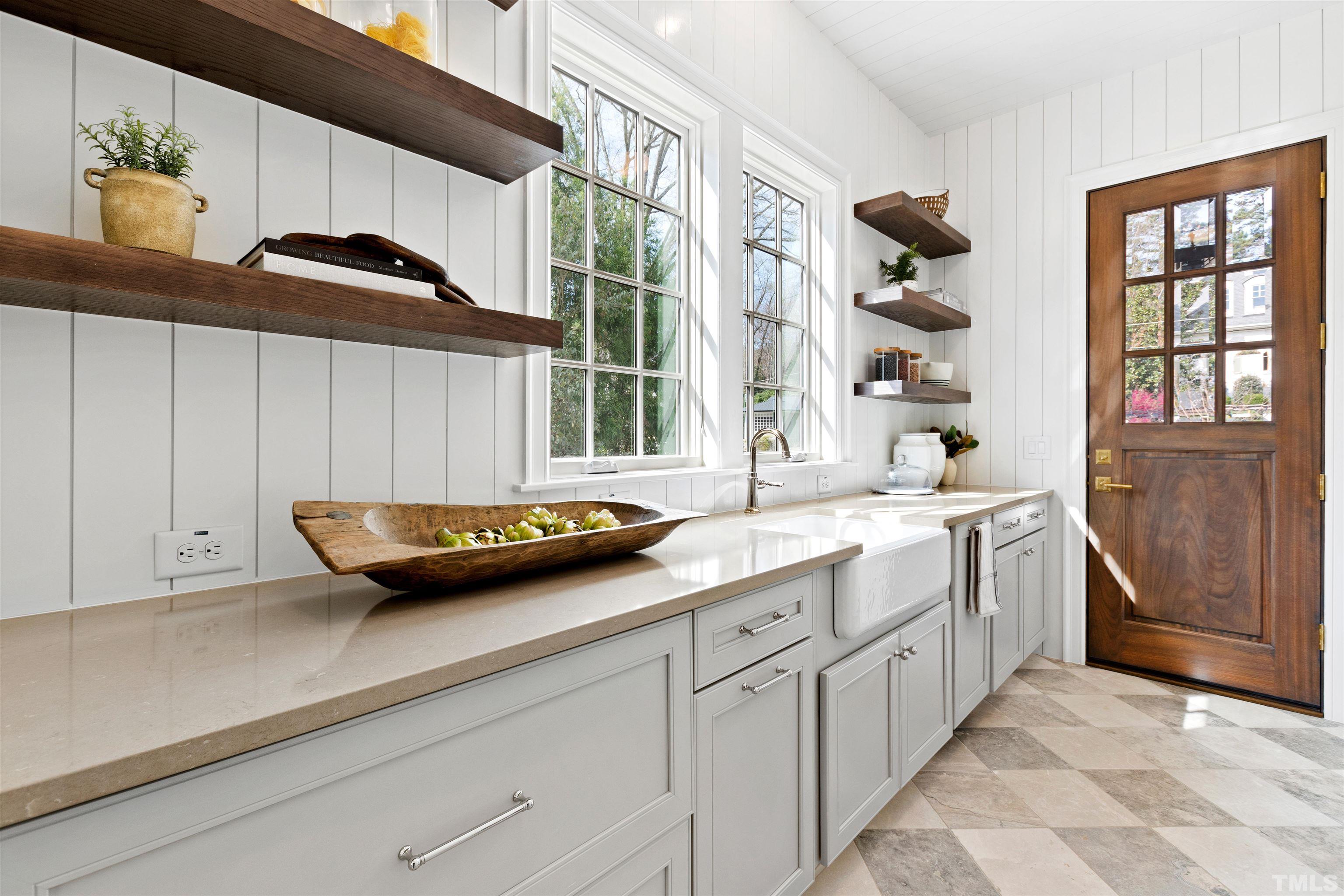 1716 Nottingham Road Raleigh, NC 27607 - Photo 22 of 78 a kitchen with cabinets and window