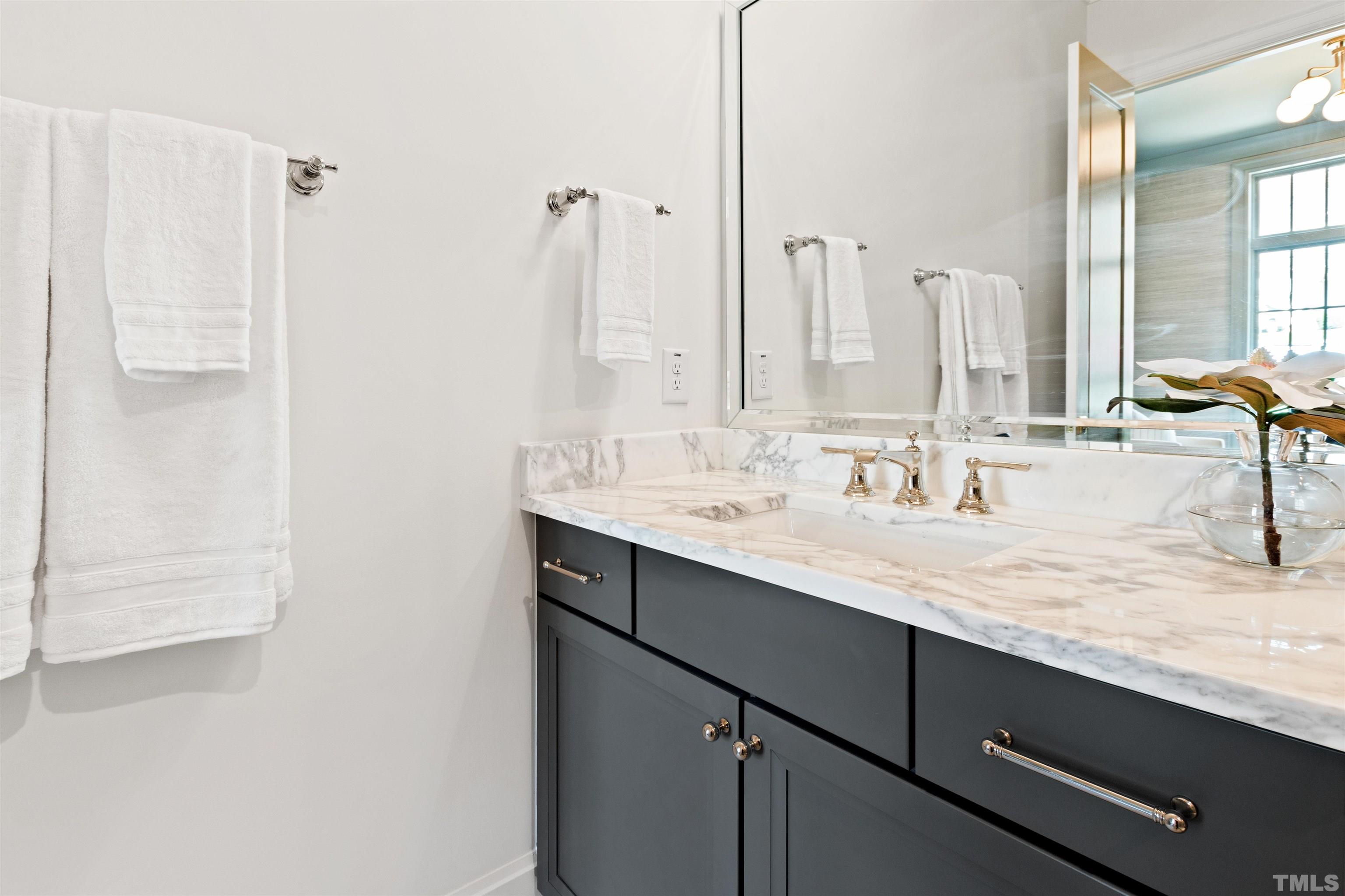 1716 Nottingham Road Raleigh, NC 27607 - Photo 27 of 78 a bathroom with a sink and a mirror