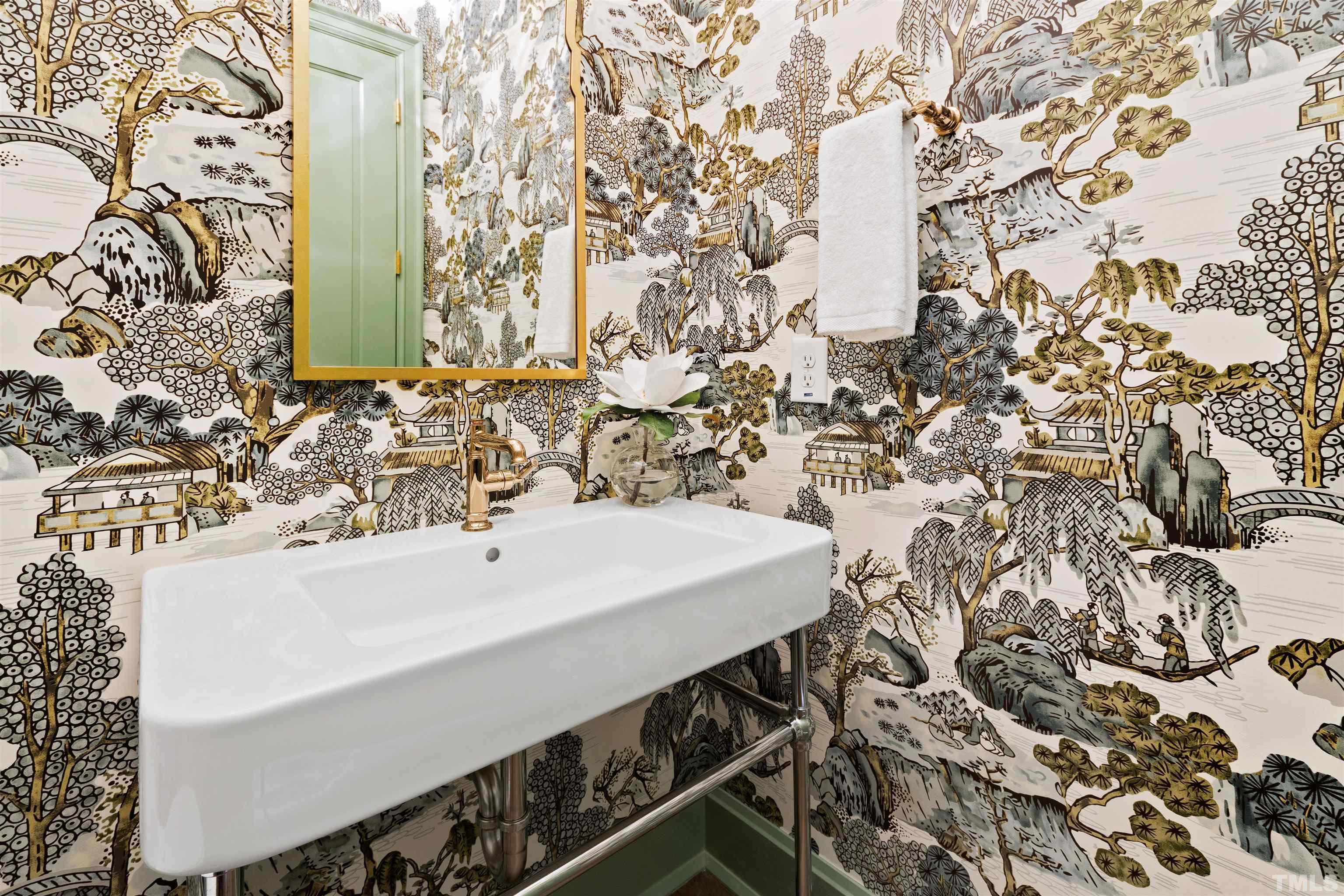 1716 Nottingham Road Raleigh, NC 27607 - Photo 28 of 78 a bathroom with a sink and a mirror