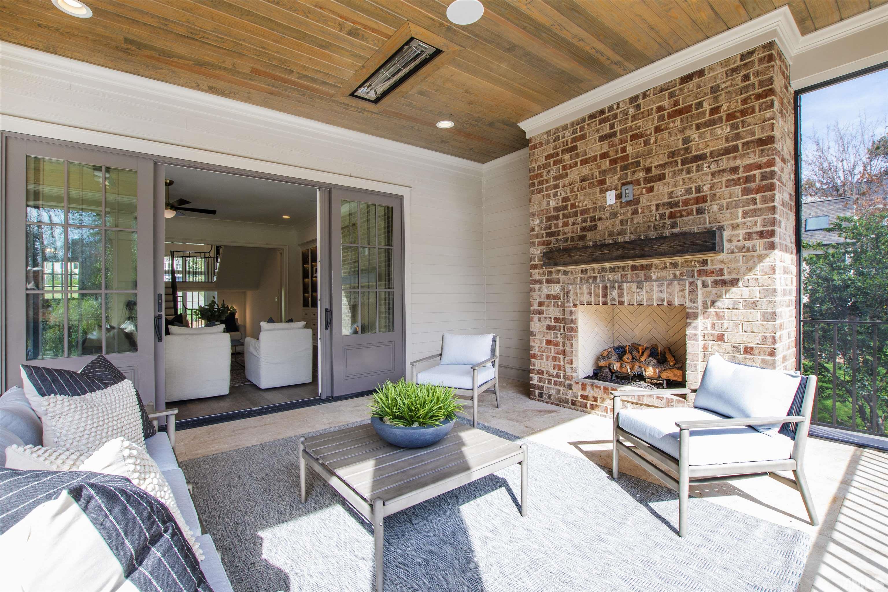 1716 Nottingham Road Raleigh, NC 27607 - Photo 29 of 78 a living room with furniture and a fireplace