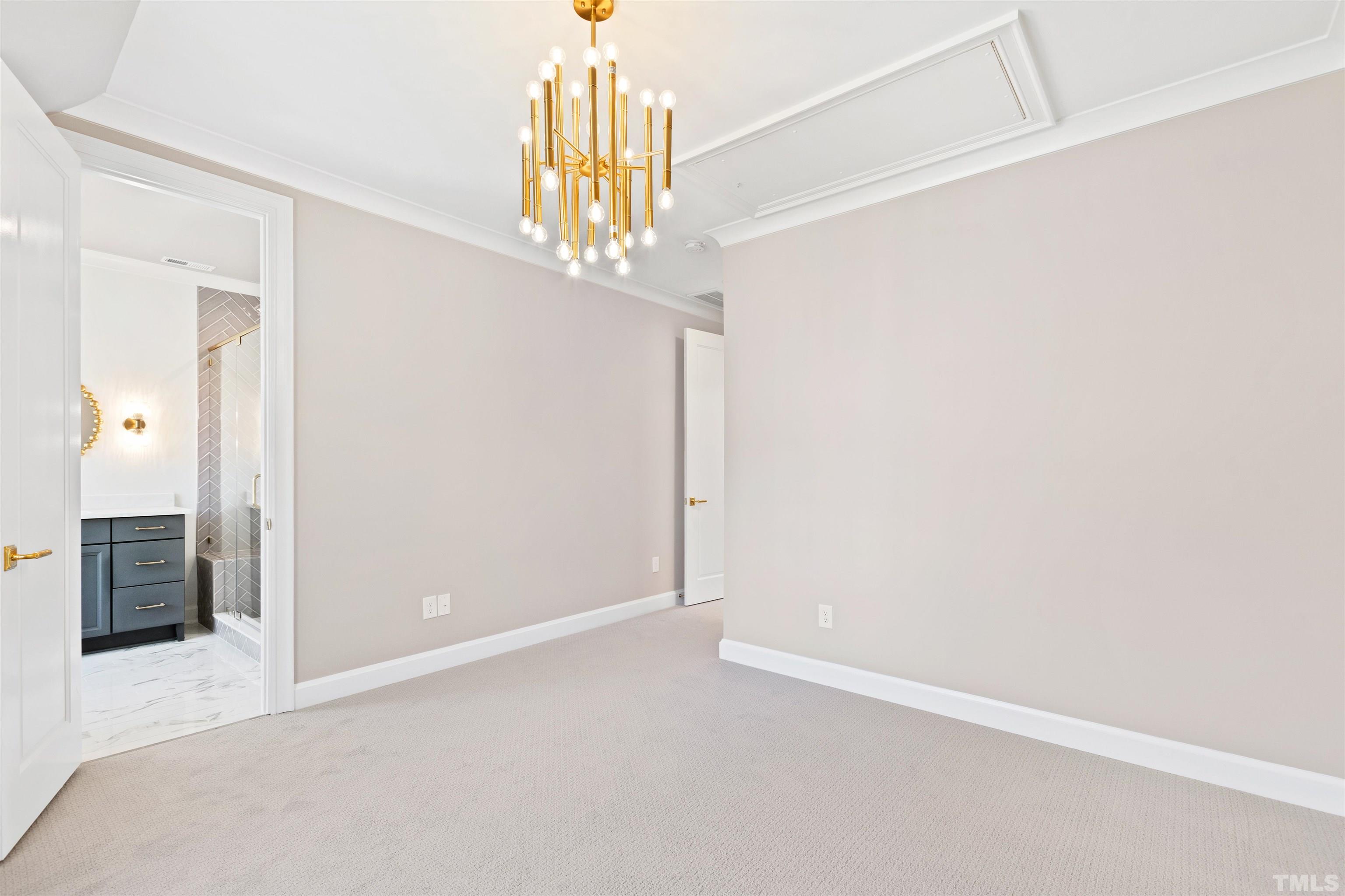 1716 Nottingham Road Raleigh, NC 27607 - Photo 45 of 78 an empty room with a chandelier fan and closet area