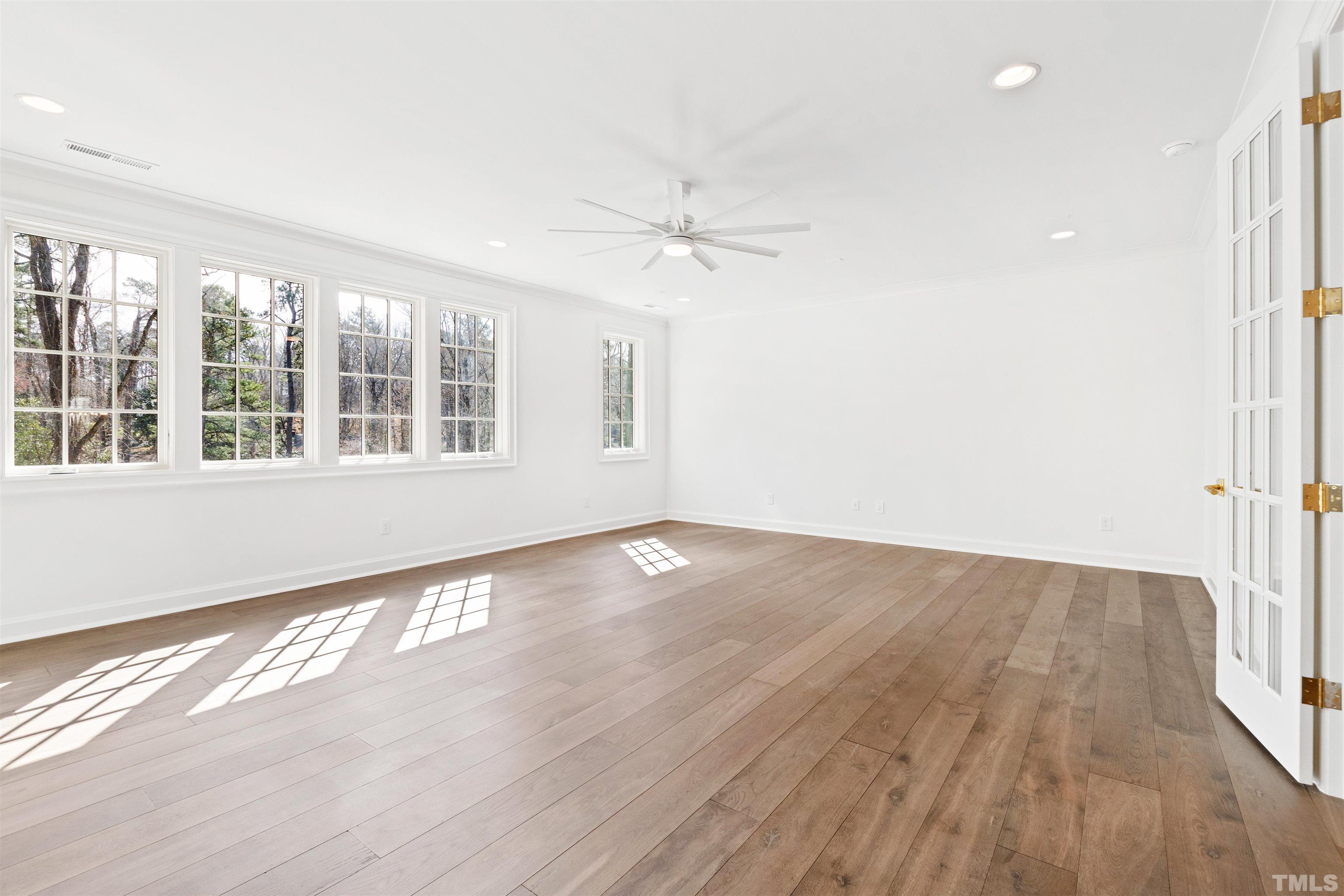 1716 Nottingham Road Raleigh, NC 27607 - Photo 48 of 78 an empty room with wooden floor and windows