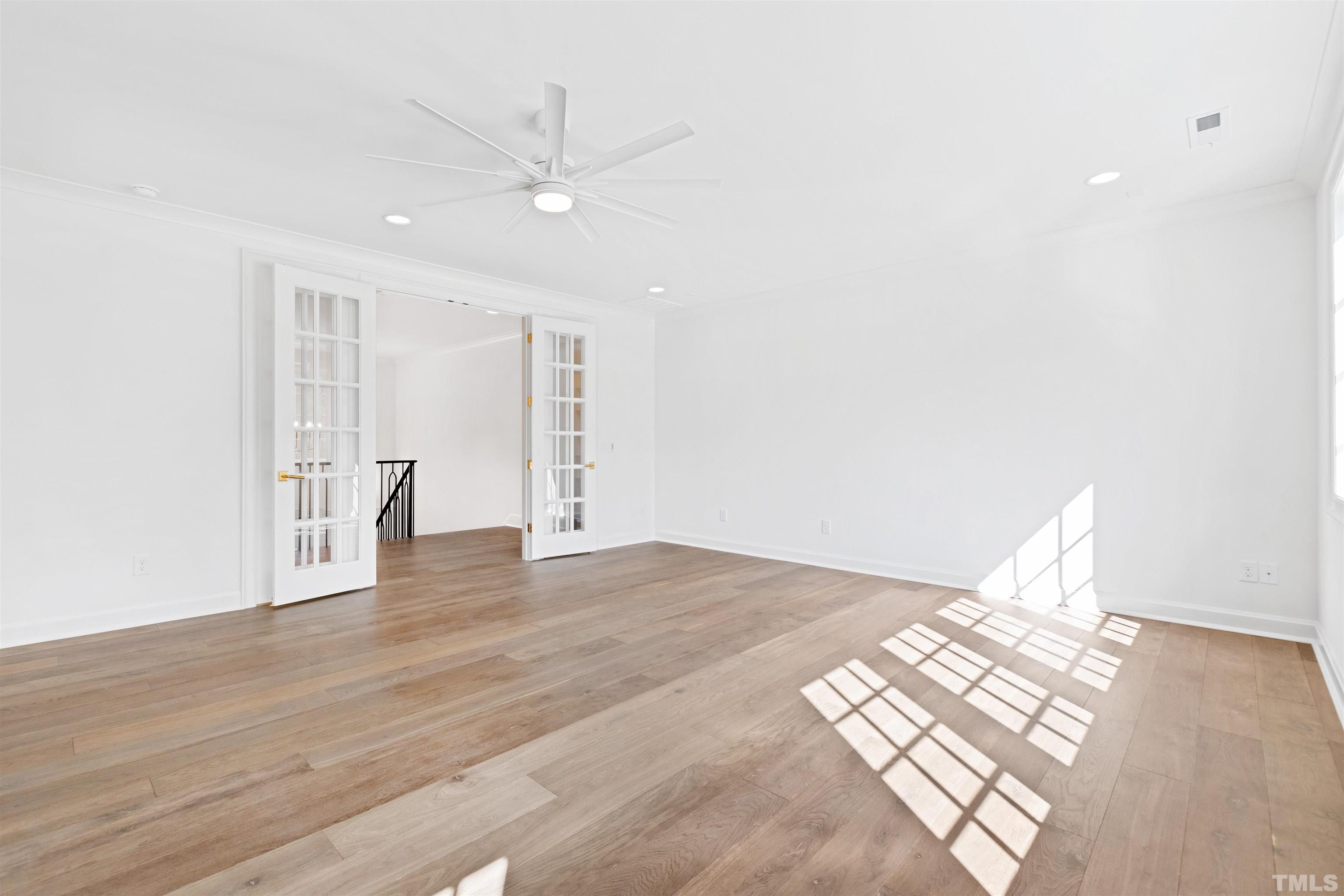 1716 Nottingham Road Raleigh, NC 27607 - Photo 49 of 78 a view of an empty room with wooden floor and a window
