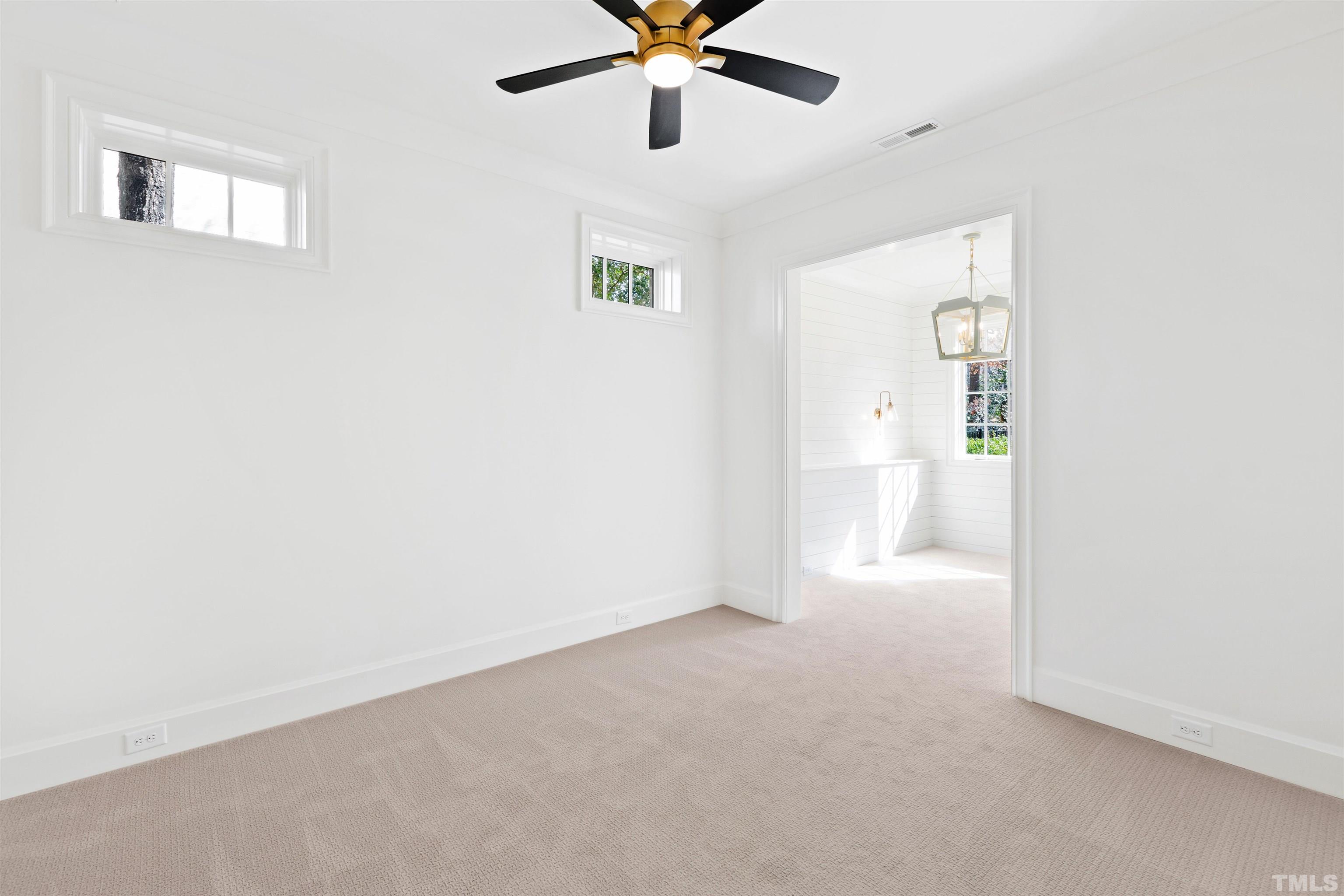 1716 Nottingham Road Raleigh, NC 27607 - Photo 64 of 78 a view of an empty room with a window