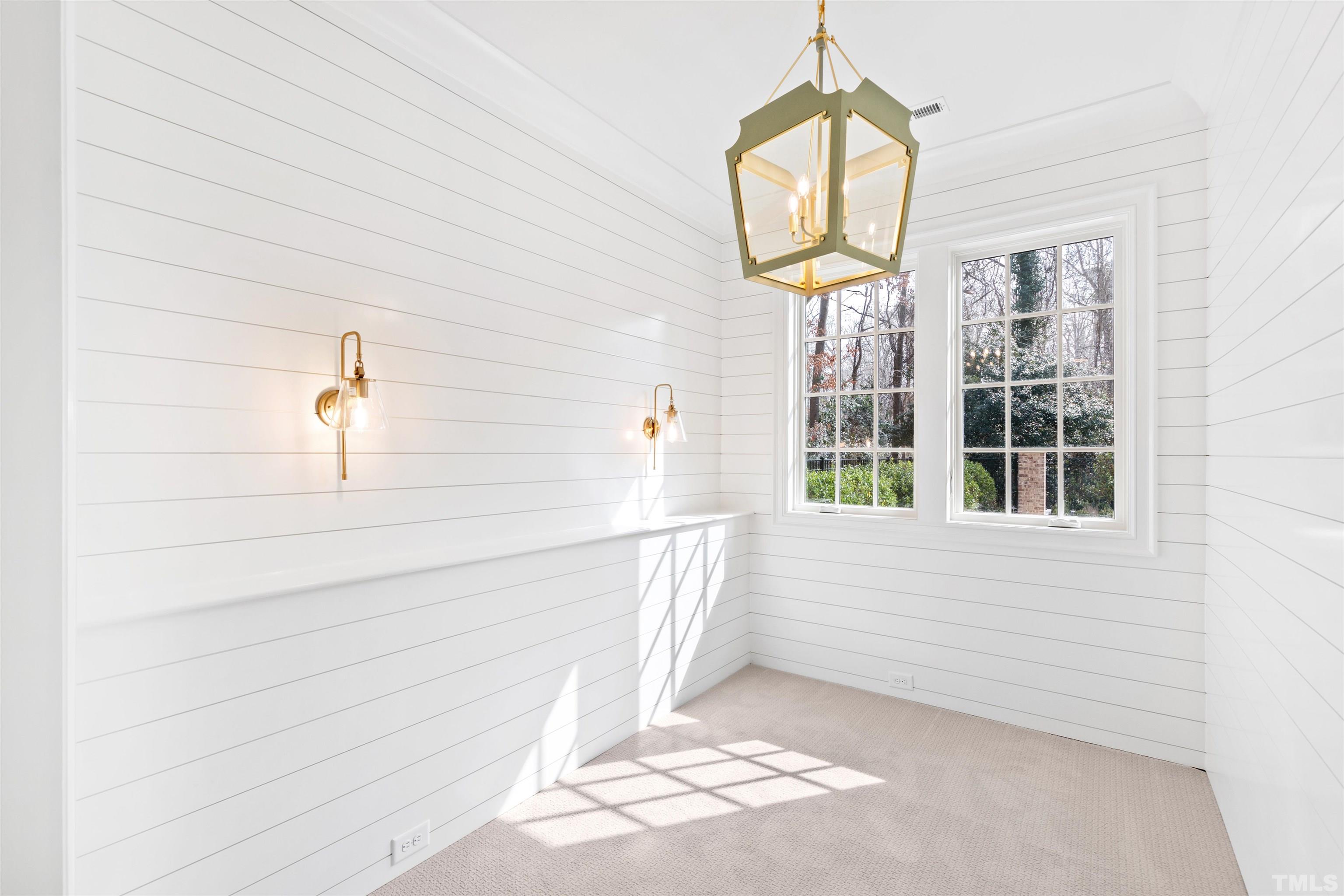 1716 Nottingham Road Raleigh, NC 27607 - Photo 65 of 78 a view of a hallway with windows