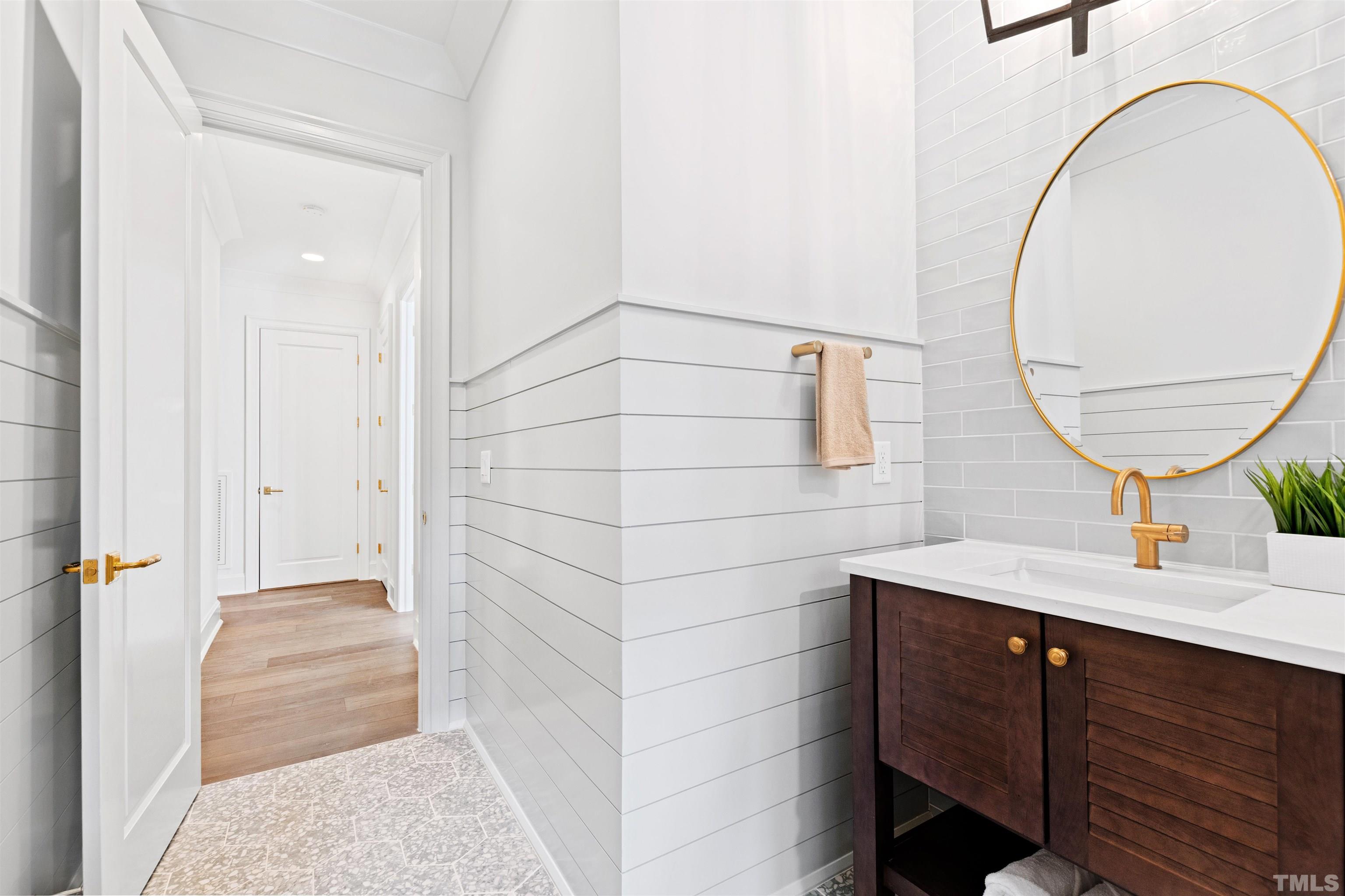 1716 Nottingham Road Raleigh, NC 27607 - Photo 66 of 78 a bathroom with a sink a mirror and vanity