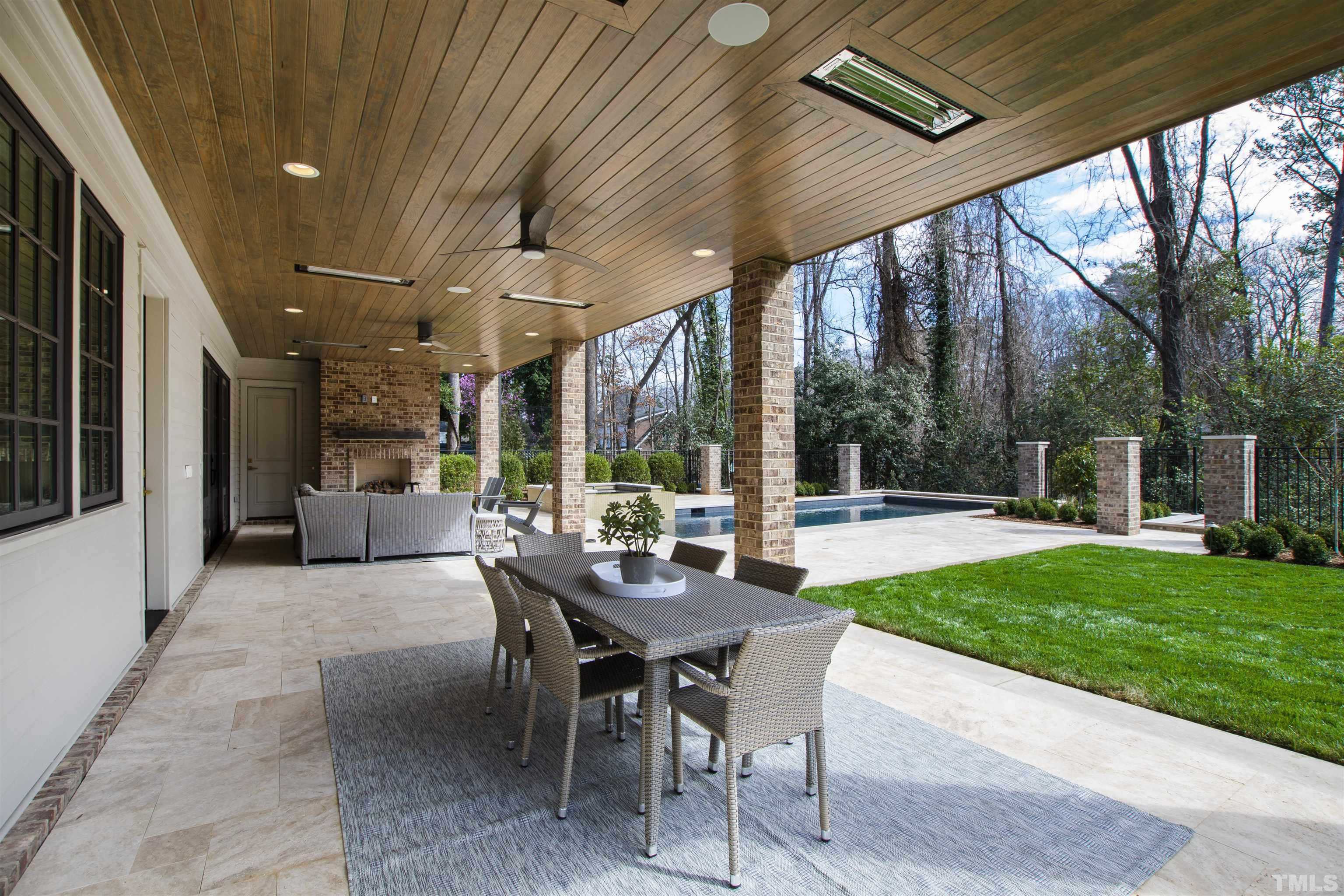 1716 Nottingham Road Raleigh, NC 27607 - Photo 69 of 78 a view of a patio with a dining table and chairs